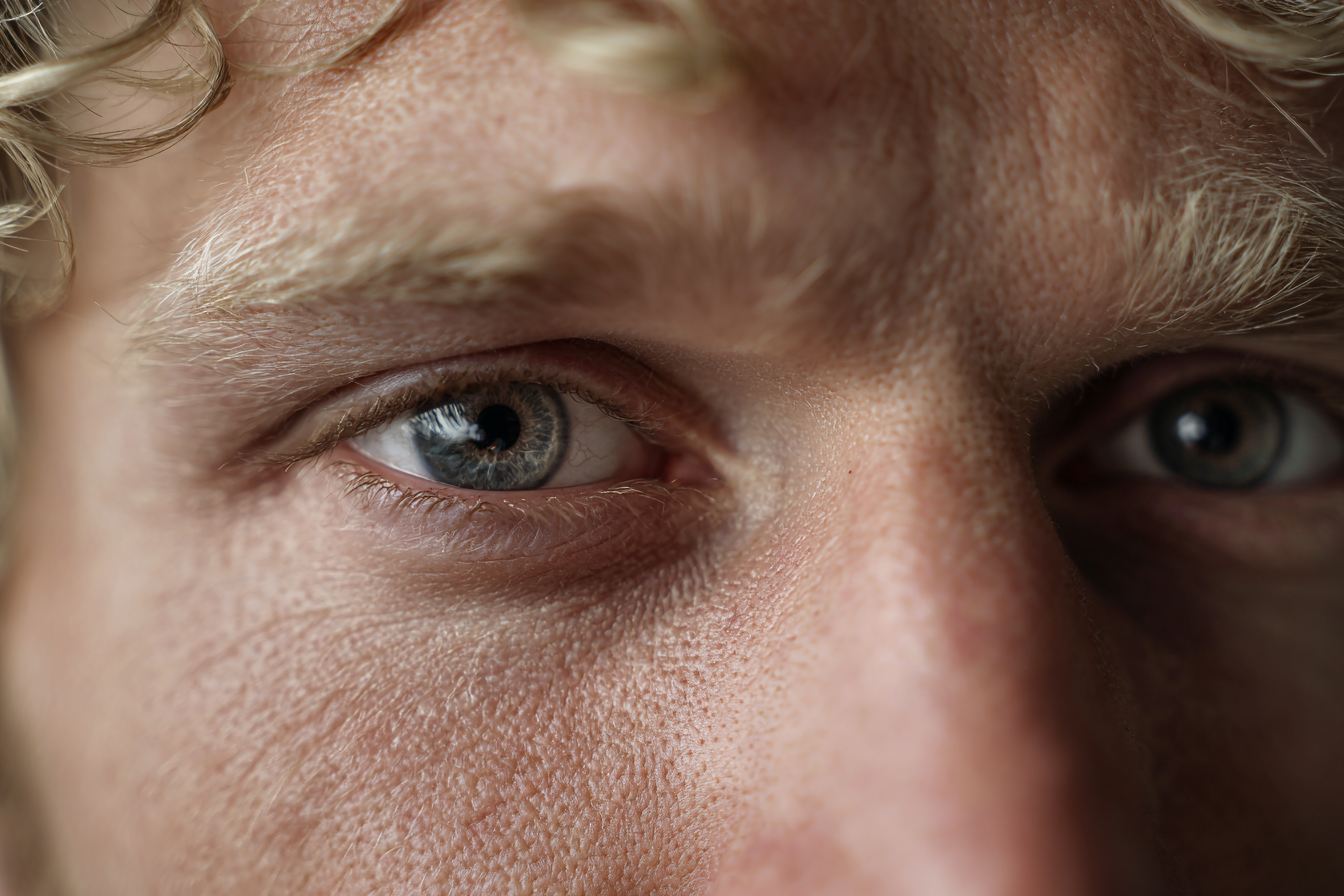 Close up of a man's emotional gaze | Source: Midjourney
