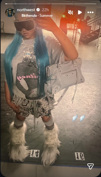 North West showed off her bright blue hair, oversized sunglasses, and layered accessories in a mirror selfie shared to Instagram Stories on May 23, 2026. | Source: Instagram/northwest