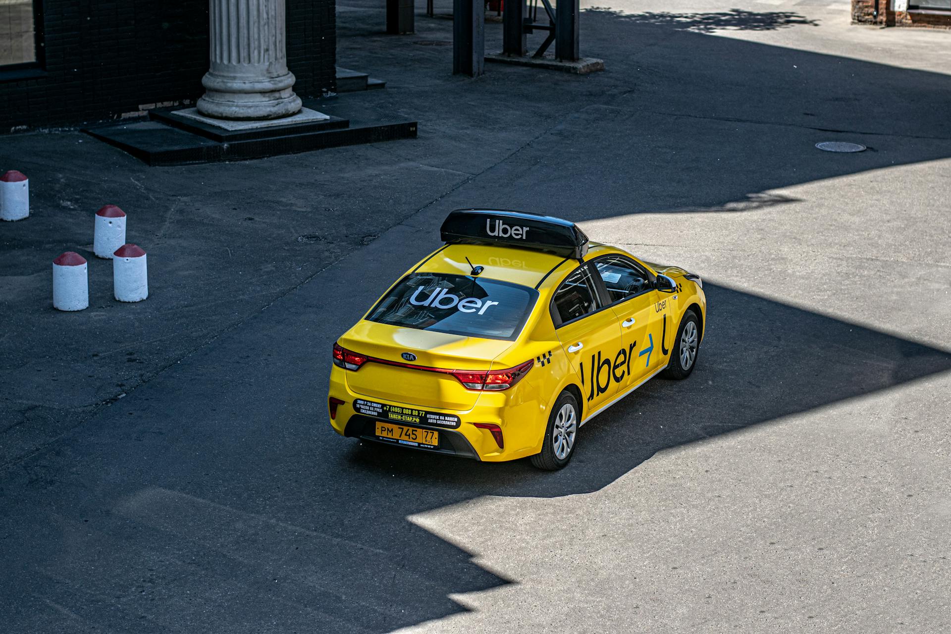 An Uber car driving on a street | Source: Pexels