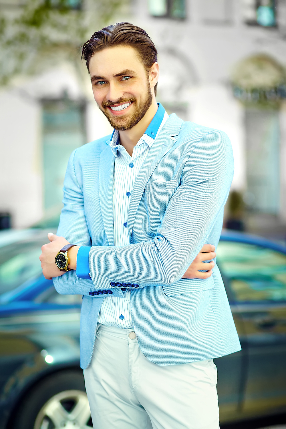 A cheerful elegant man standing near his car | Source: Freepik