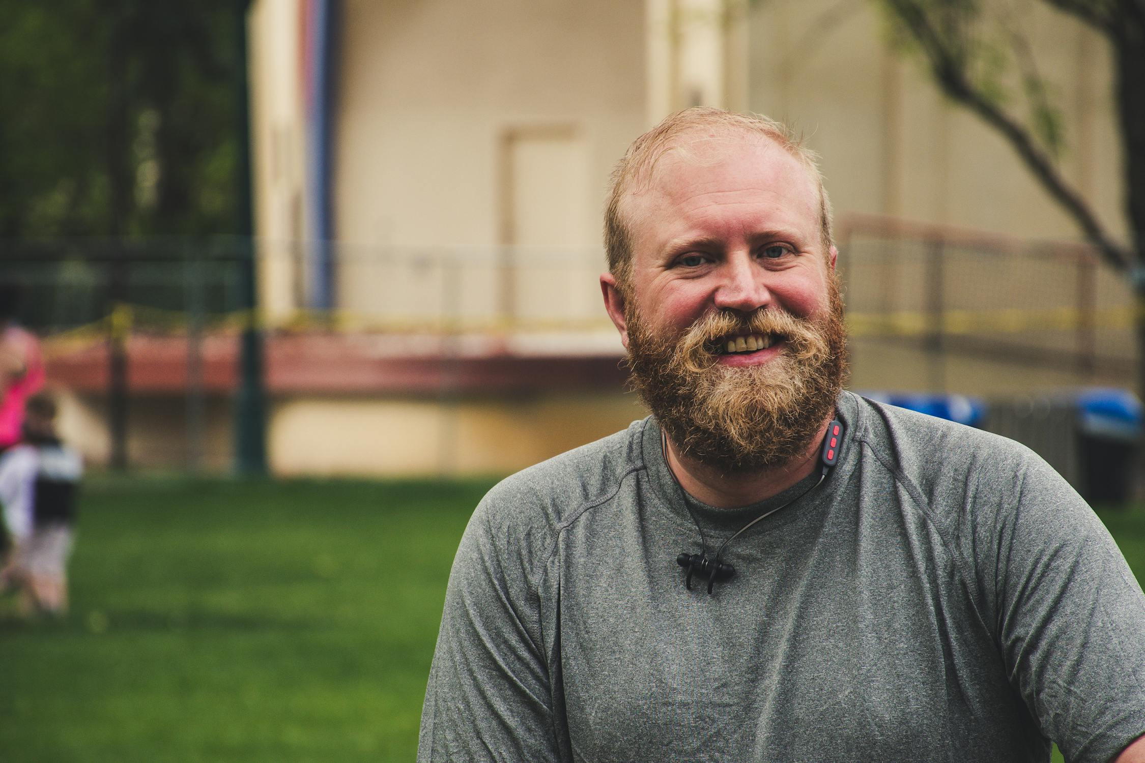 A smiling man in his yard | Source: Pexels