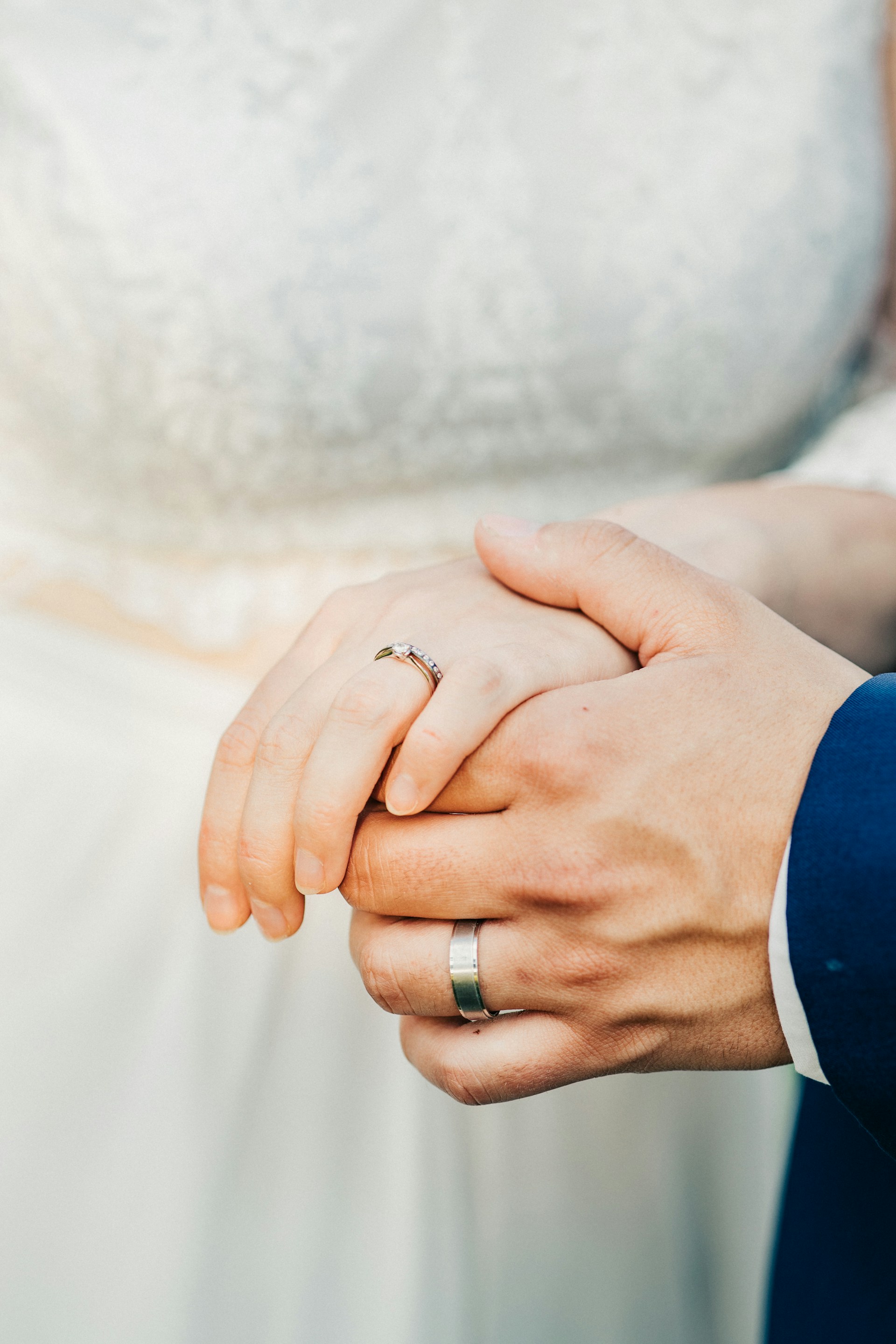 A newlywed couple flaunting their wedding rings | Source: Unsplash