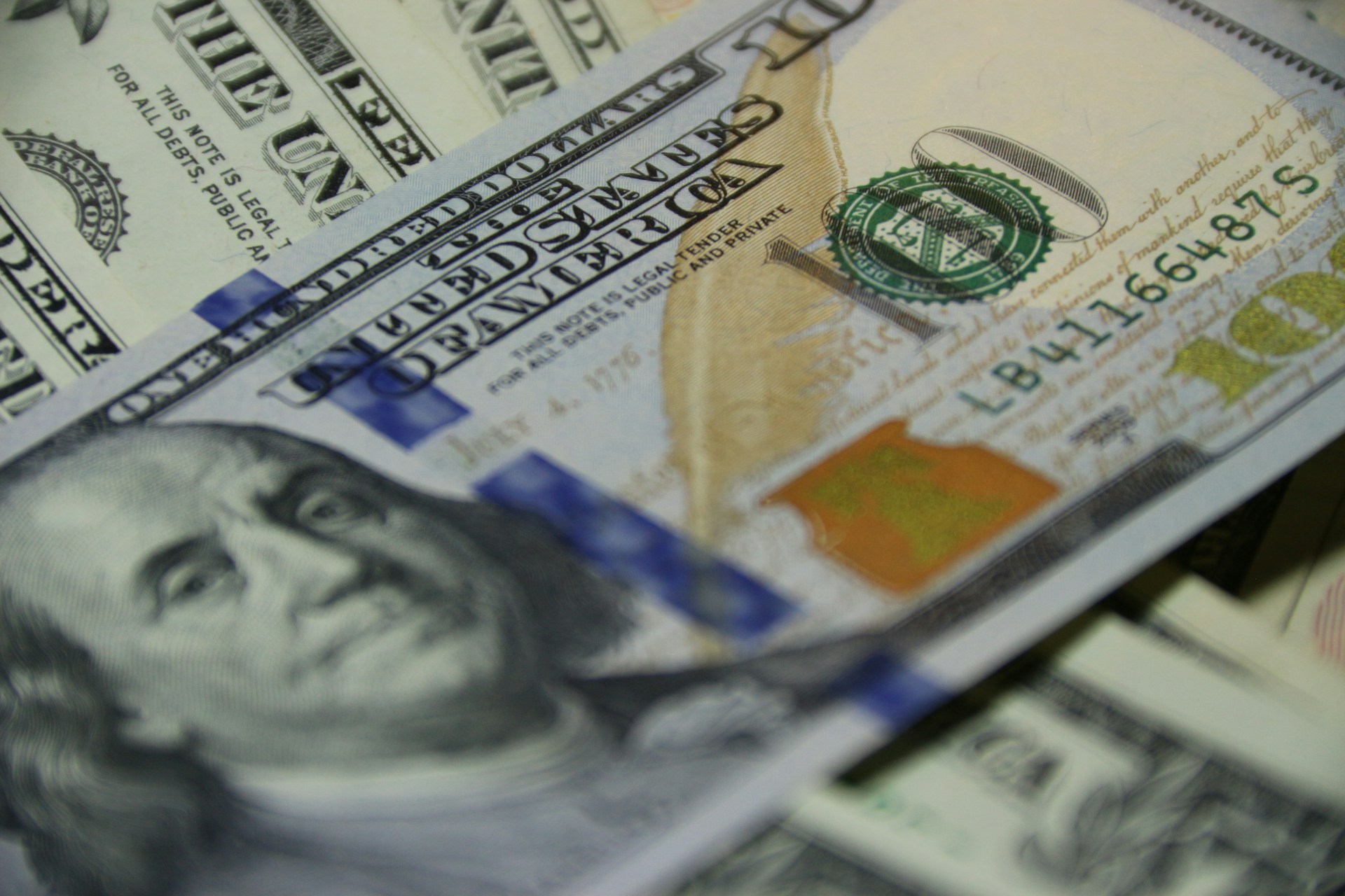Close-up shot of dollar bills | Source: Unsplash