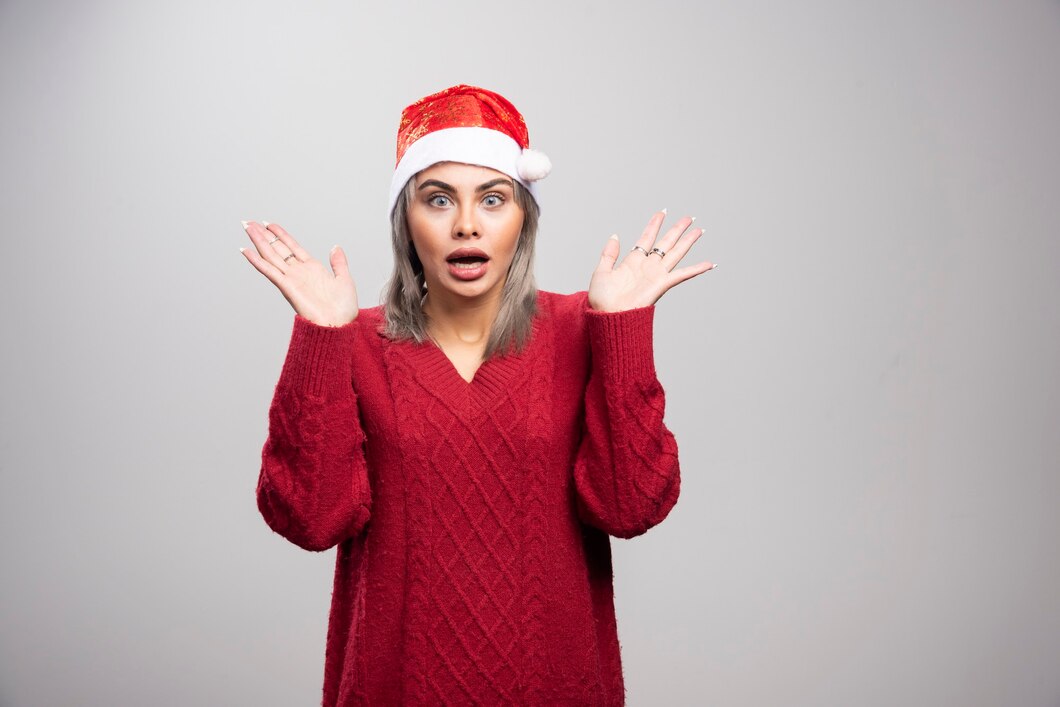 A shocked woman in a festive hat | Source: Pexels