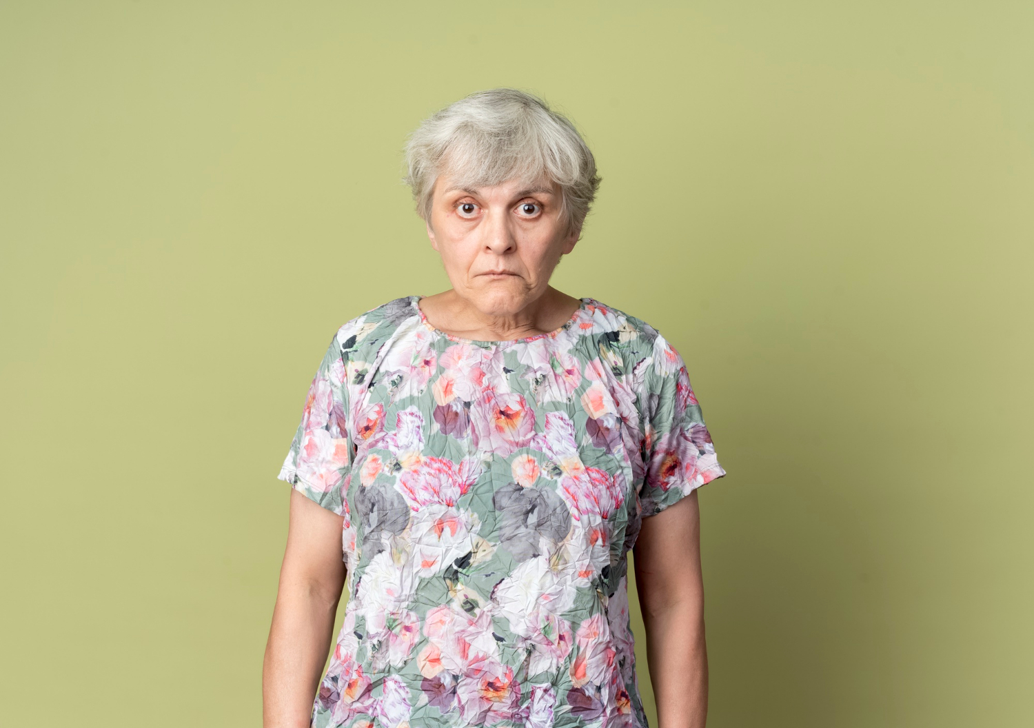 A stunned elderly woman | Source: Freepik