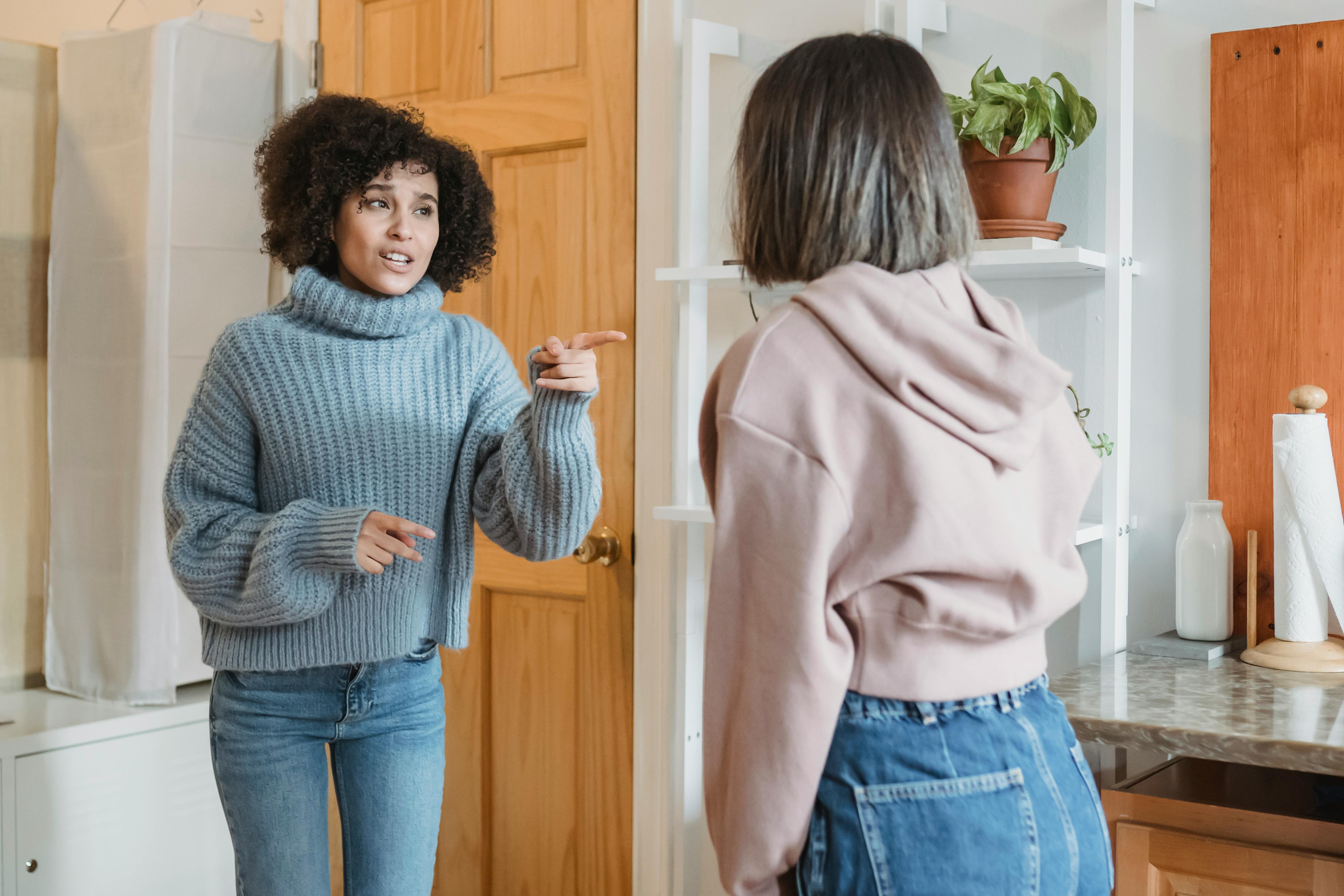 A woman pointing a finger at another woman during an argument | Source: Pexels