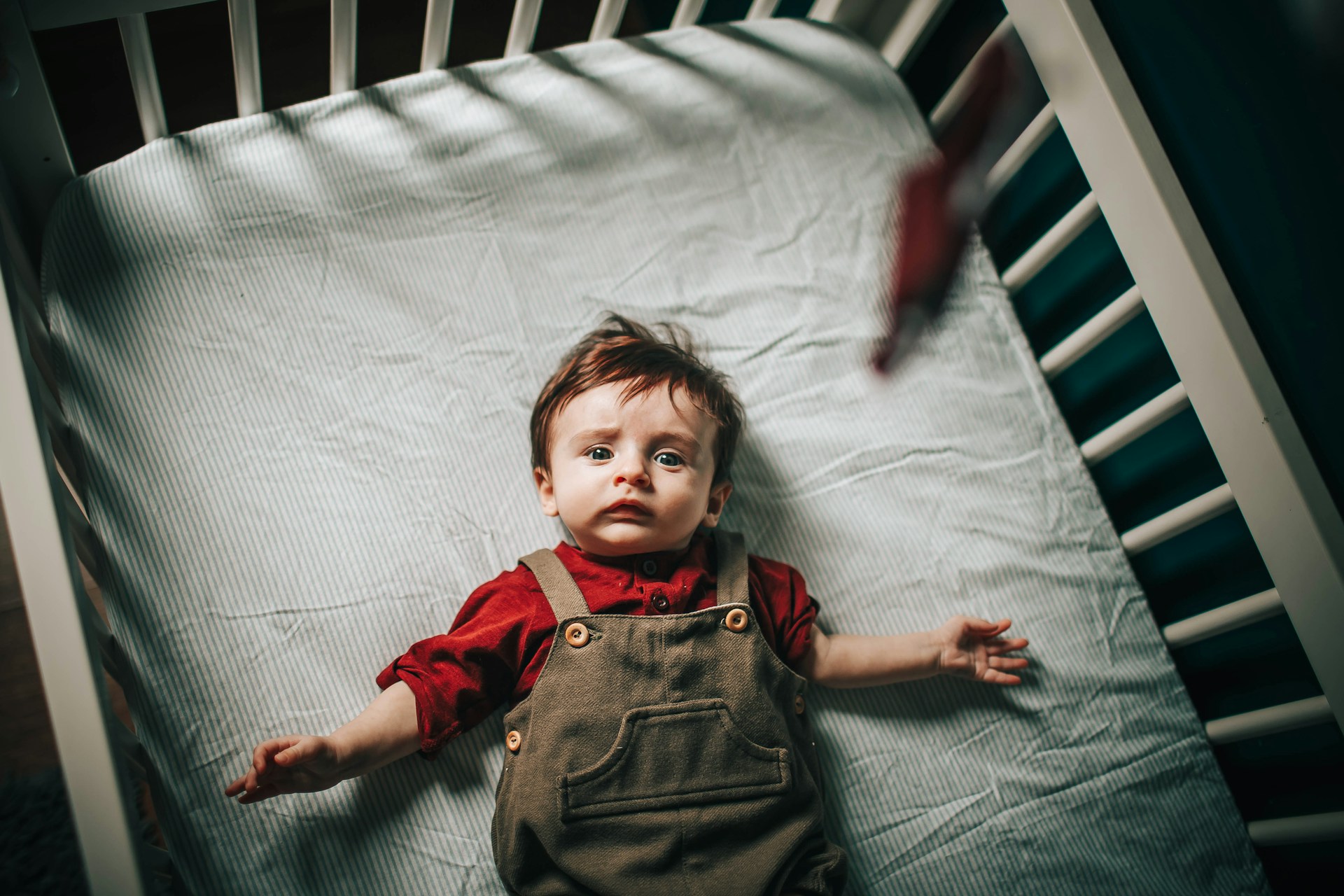 A baby boy in a crib | Source: Unsplash