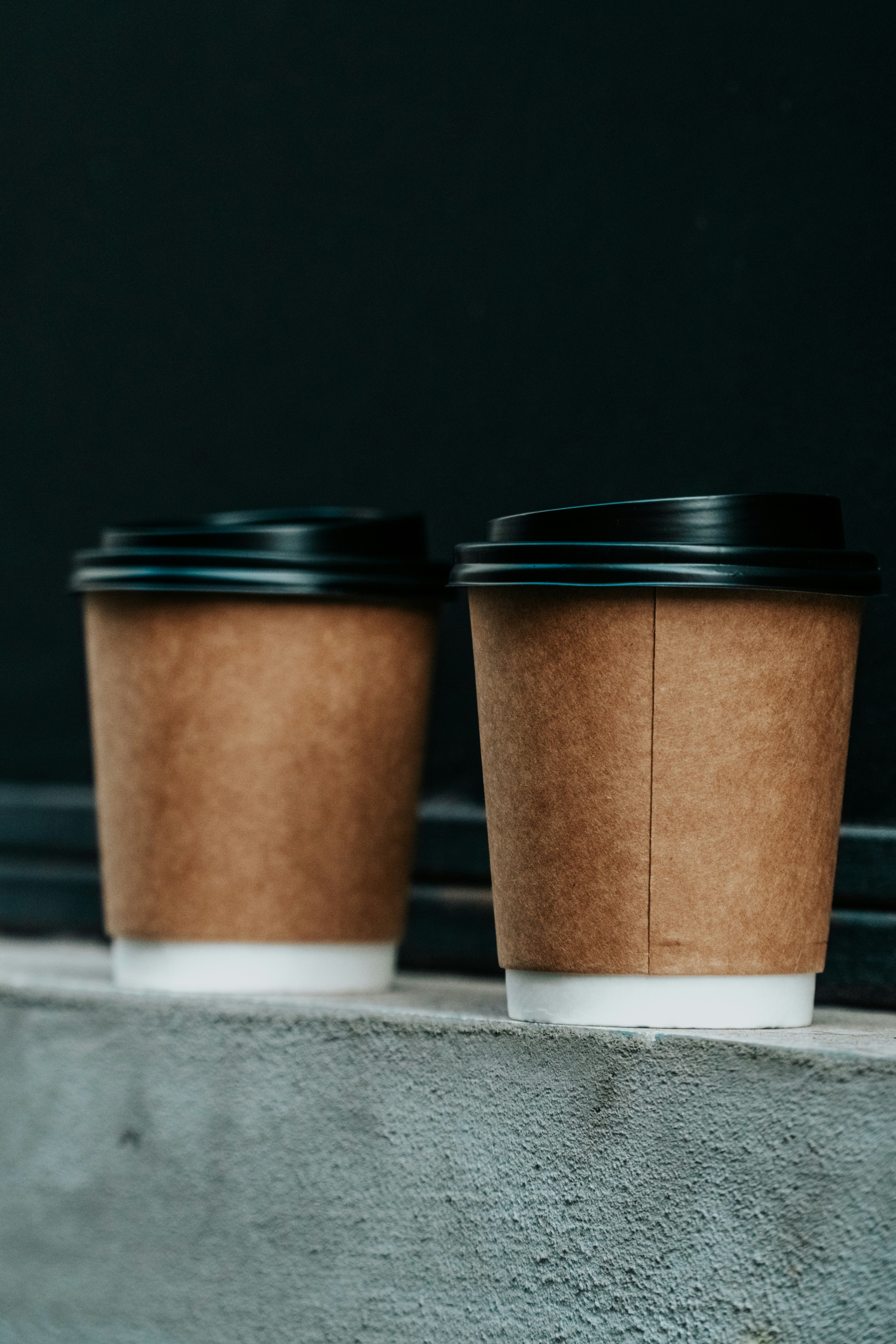 Two cups of coffee on a table | Source: Unsplash