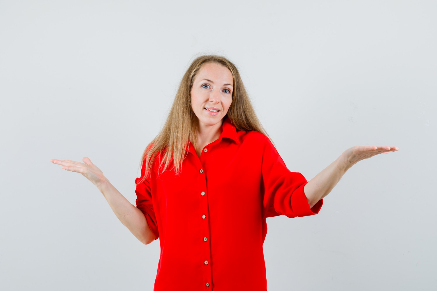 A mature woman shrugging | Source: Freepik