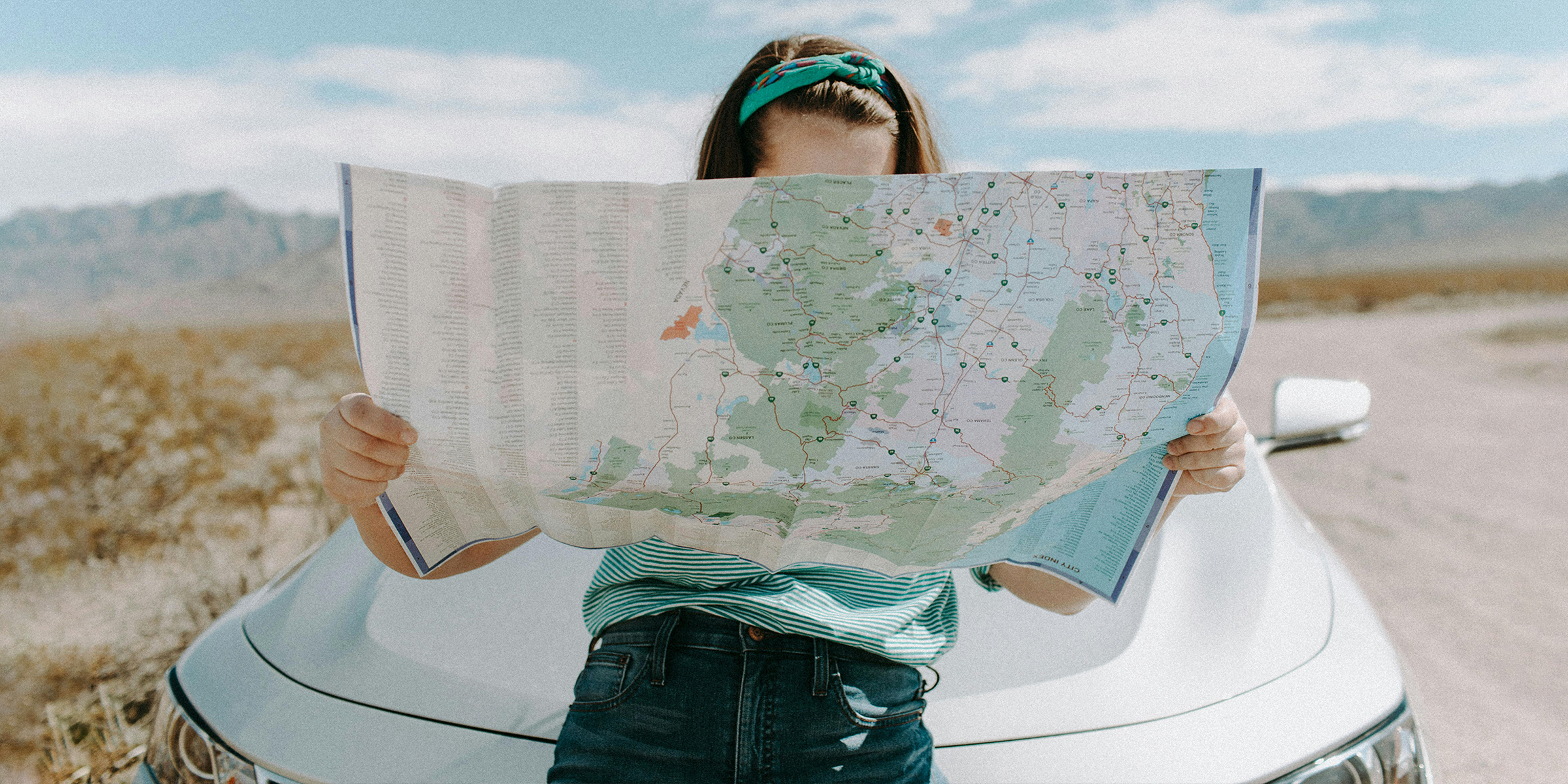 A woman with a map | Source: Shutterstock