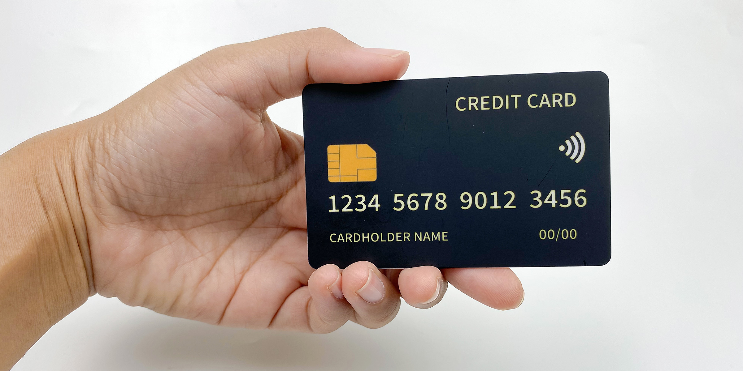A person holding a bank card | Source: Shutterstock