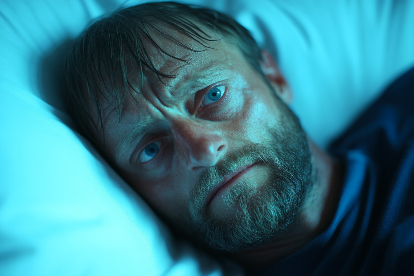 A man lying in a hospital bed | Source: Midjourney