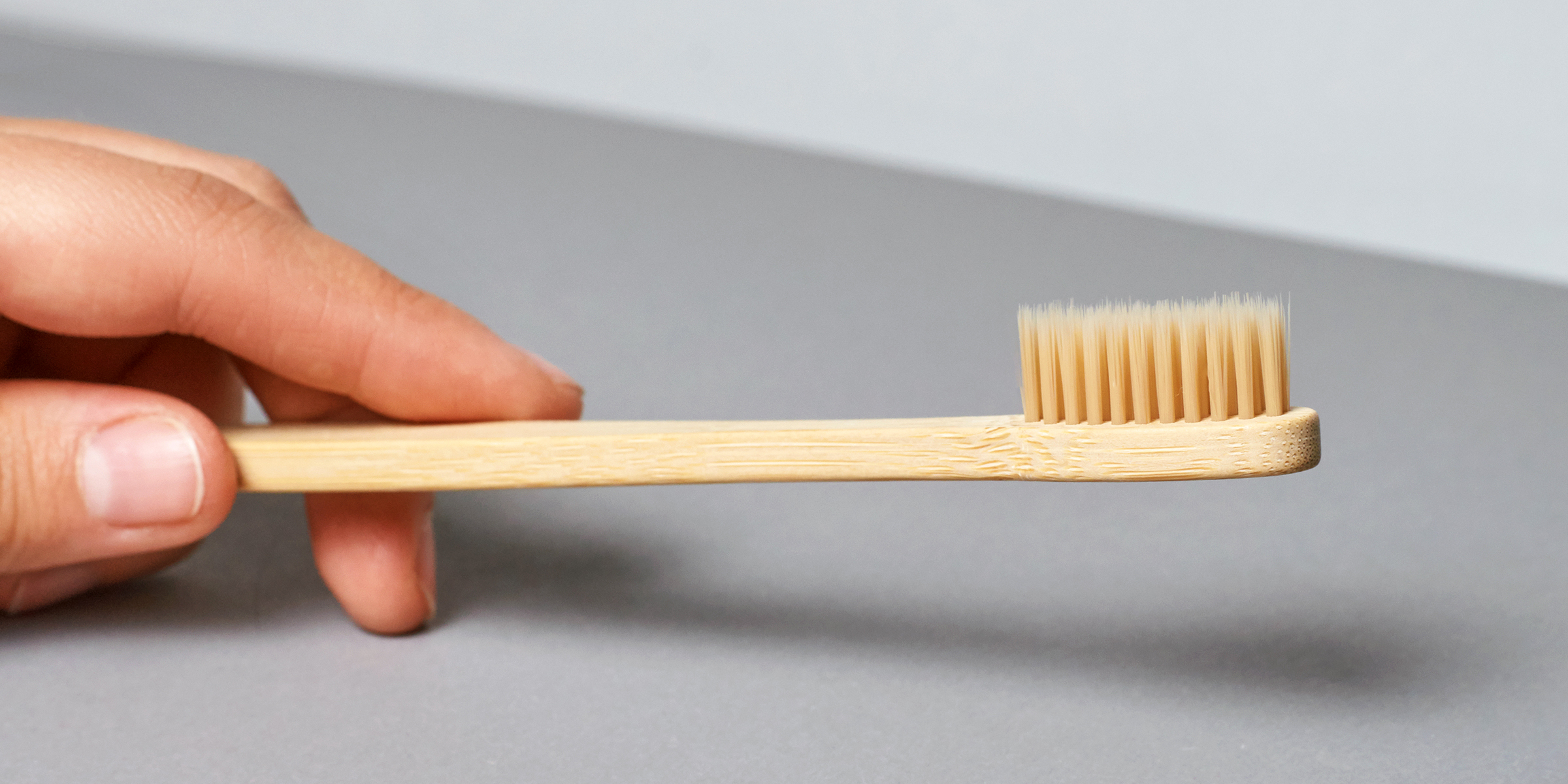 A person holding a toothbrush | Source: Shutterstock