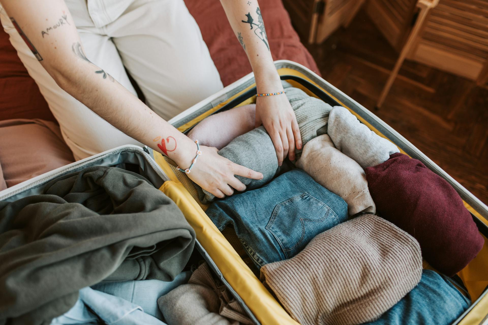 A person packing a suitcase | Source: Pexels