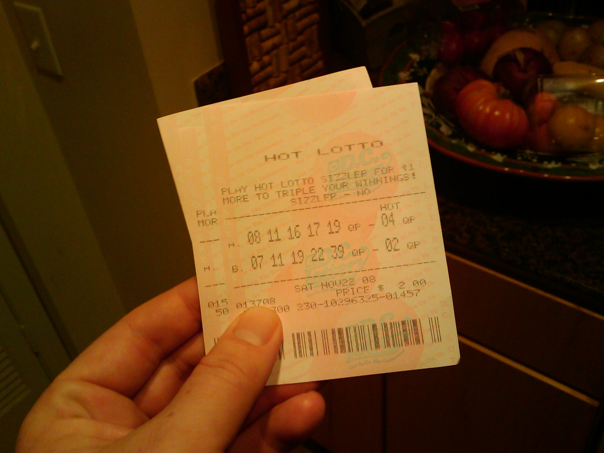 A man holding lottery tickets | Source: Flickr