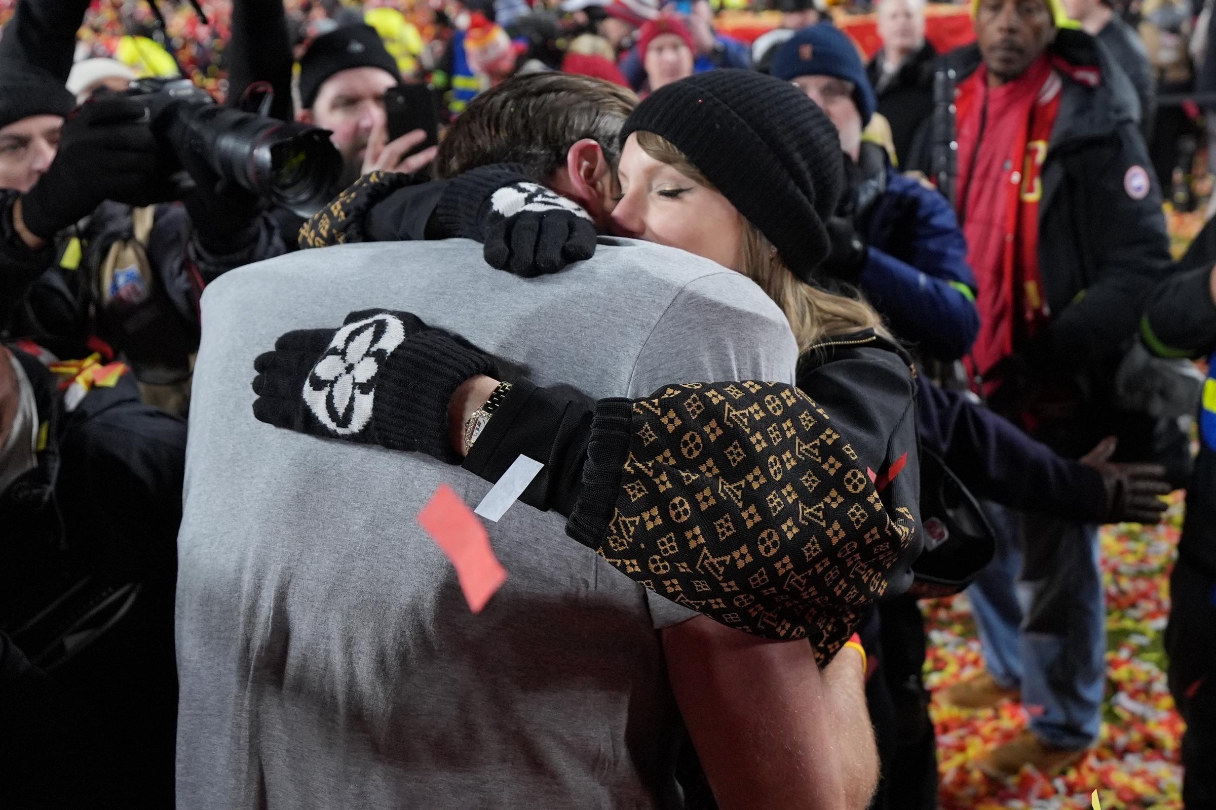 Travis Kelce and Taylor Swift are seen embracing each other at GEHA Field, on January 26, 2025 | Source: Getty Images