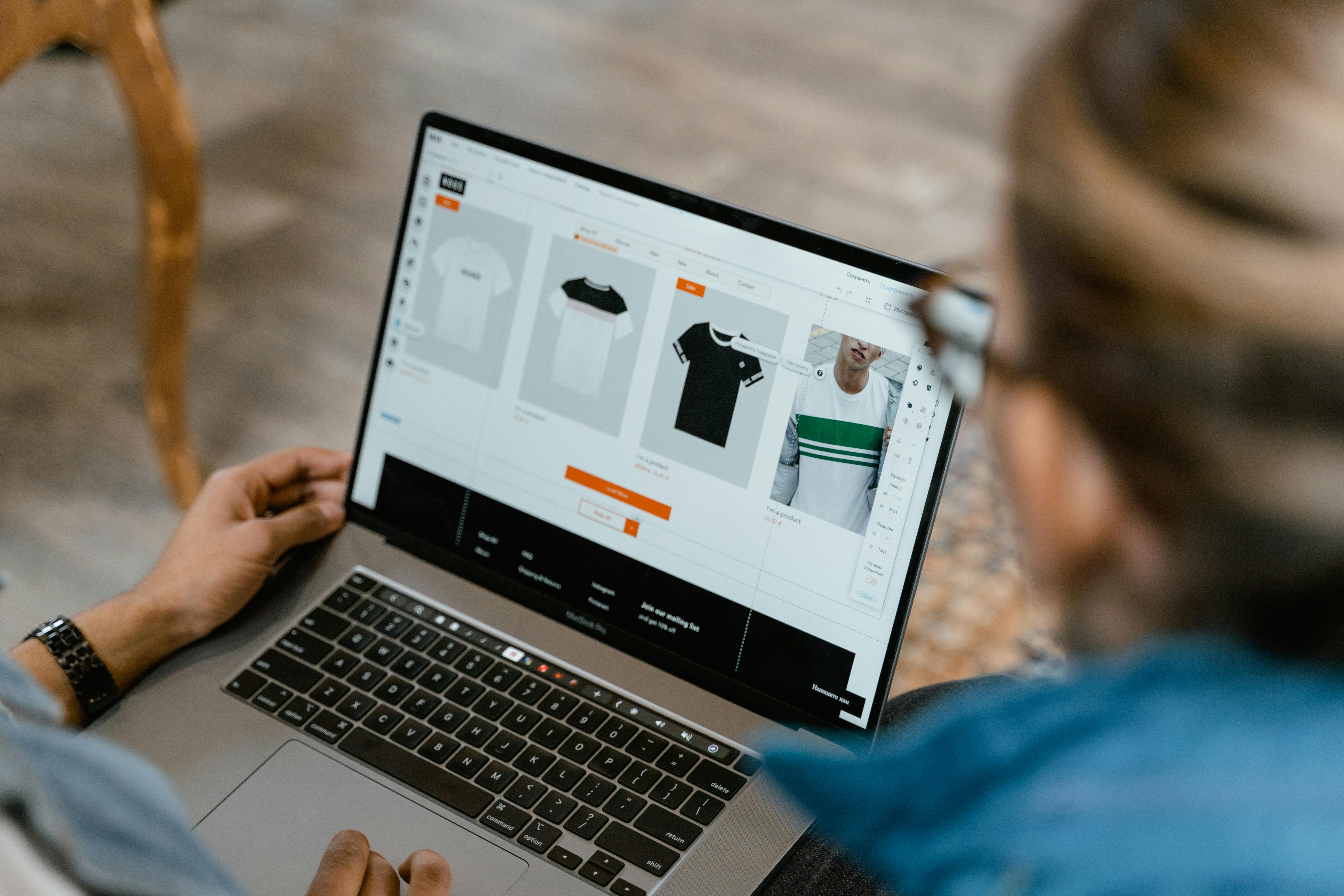 People looking at a laptop together | Source: Pexels