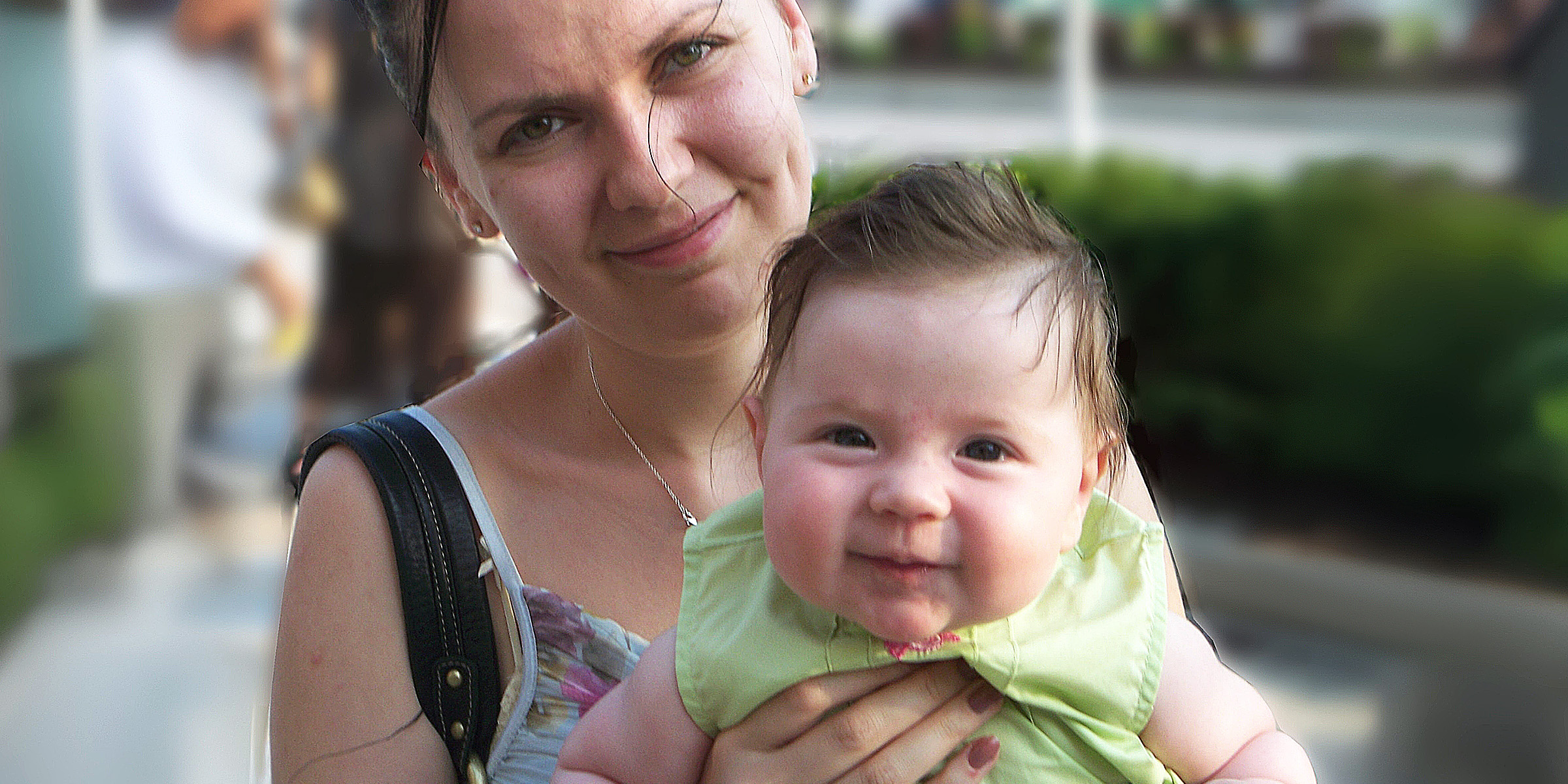 A woman holding a baby | Source: Flickr