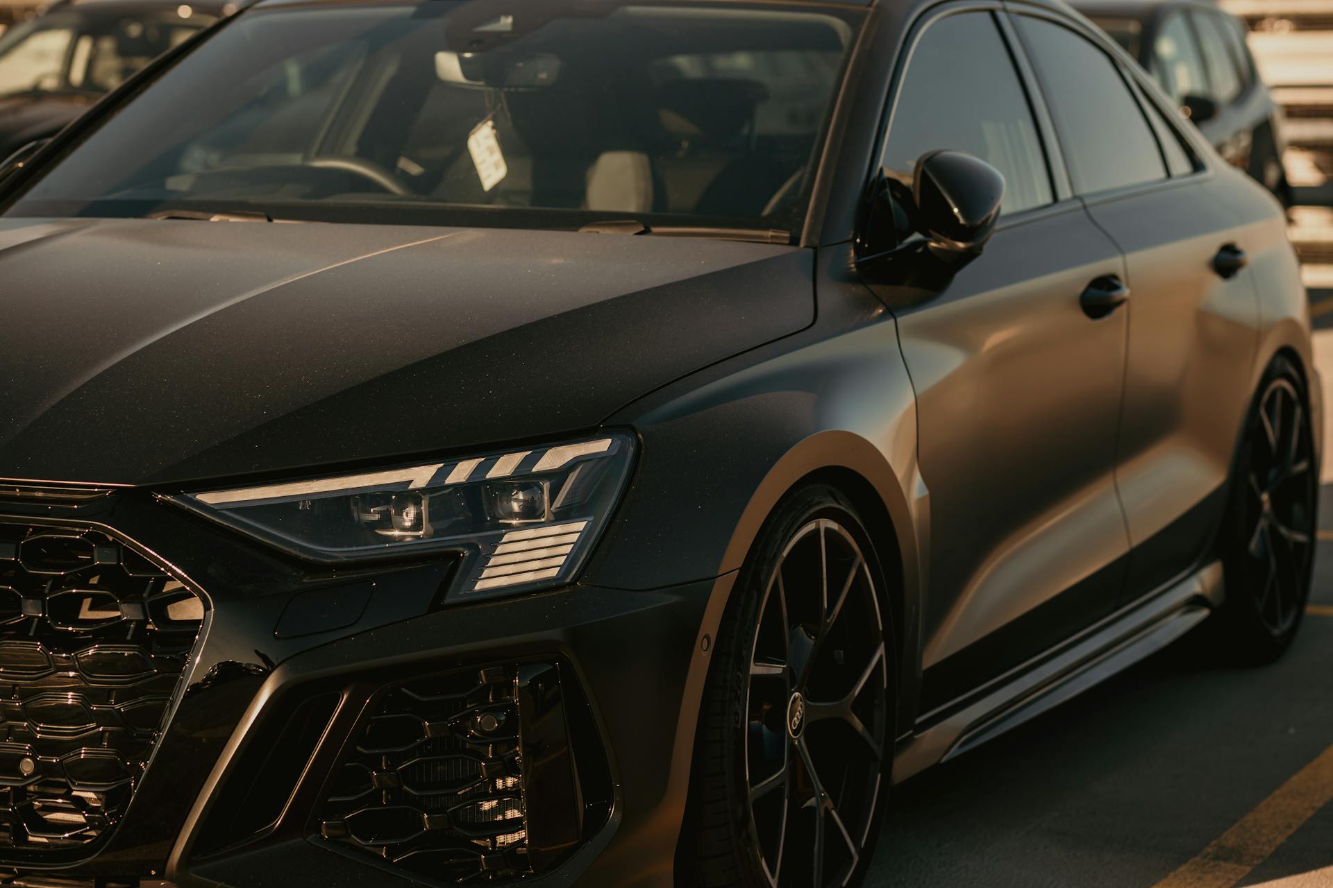 A black car in a parking lot | Source: Pexels