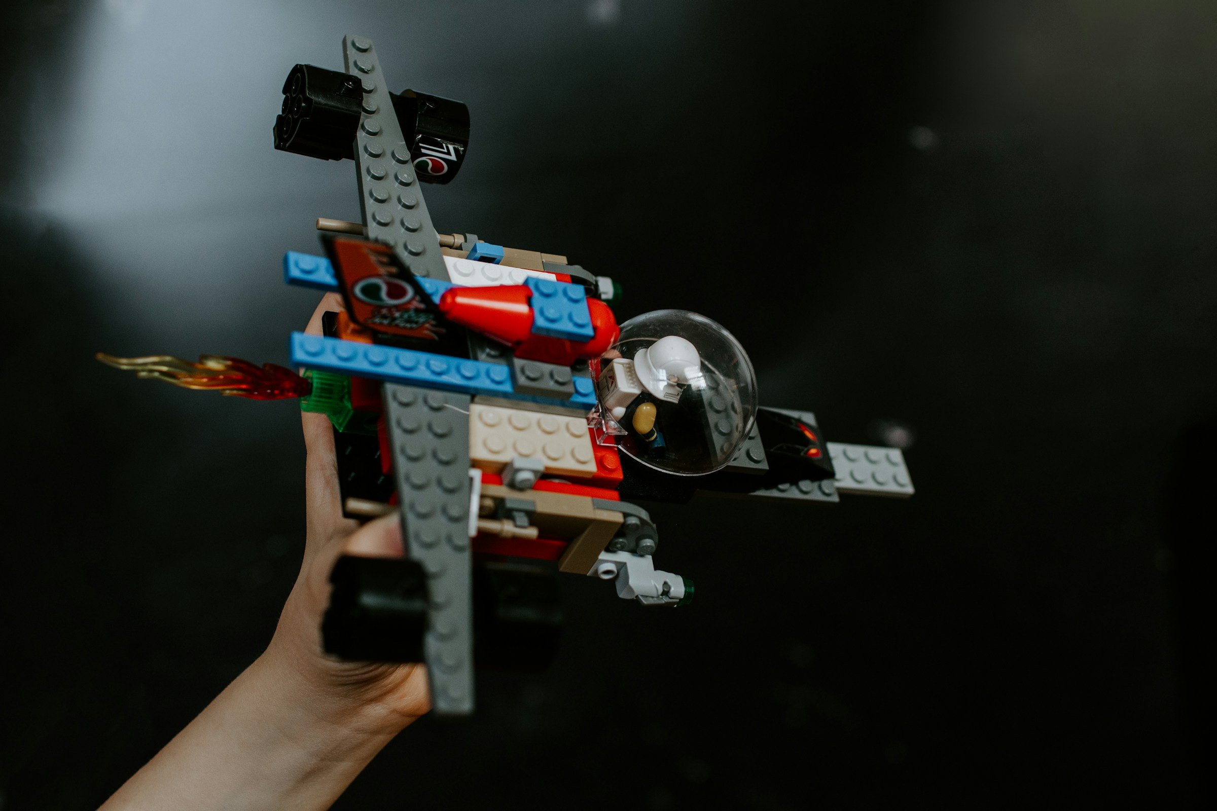 A person holding a red and blue Lego toy | Source: Unsplash