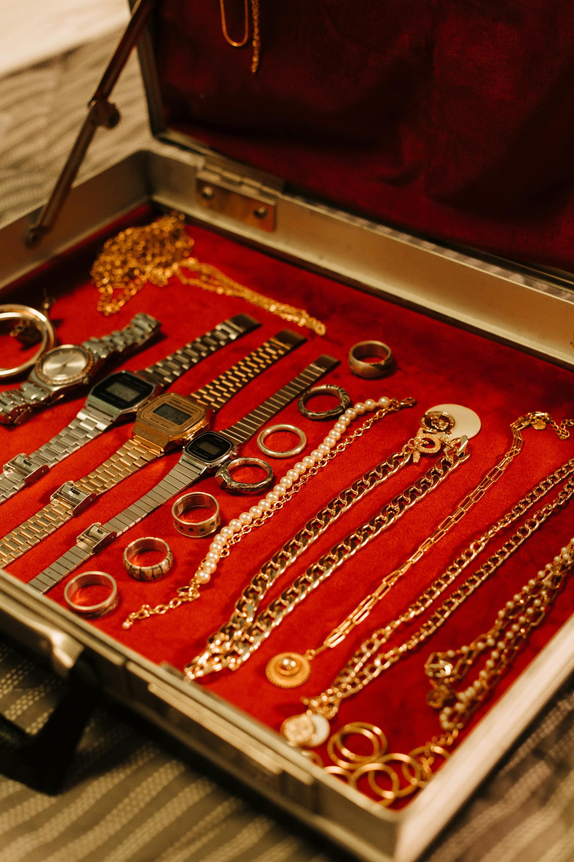 A jewelry box with watches, bracelets, necklaces, and rings | Source: Pexels