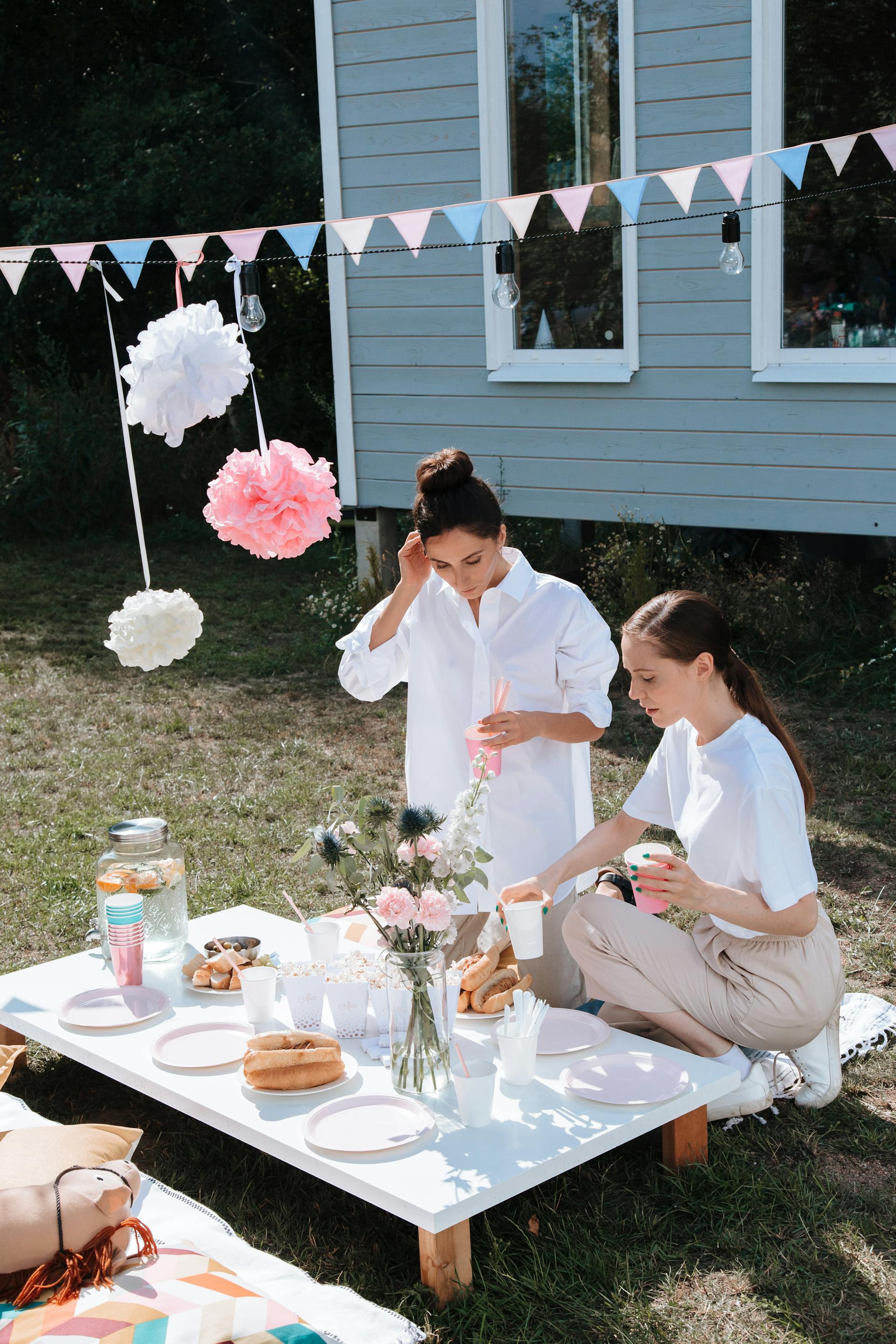 Two women at a backyard party | Source: Pexels