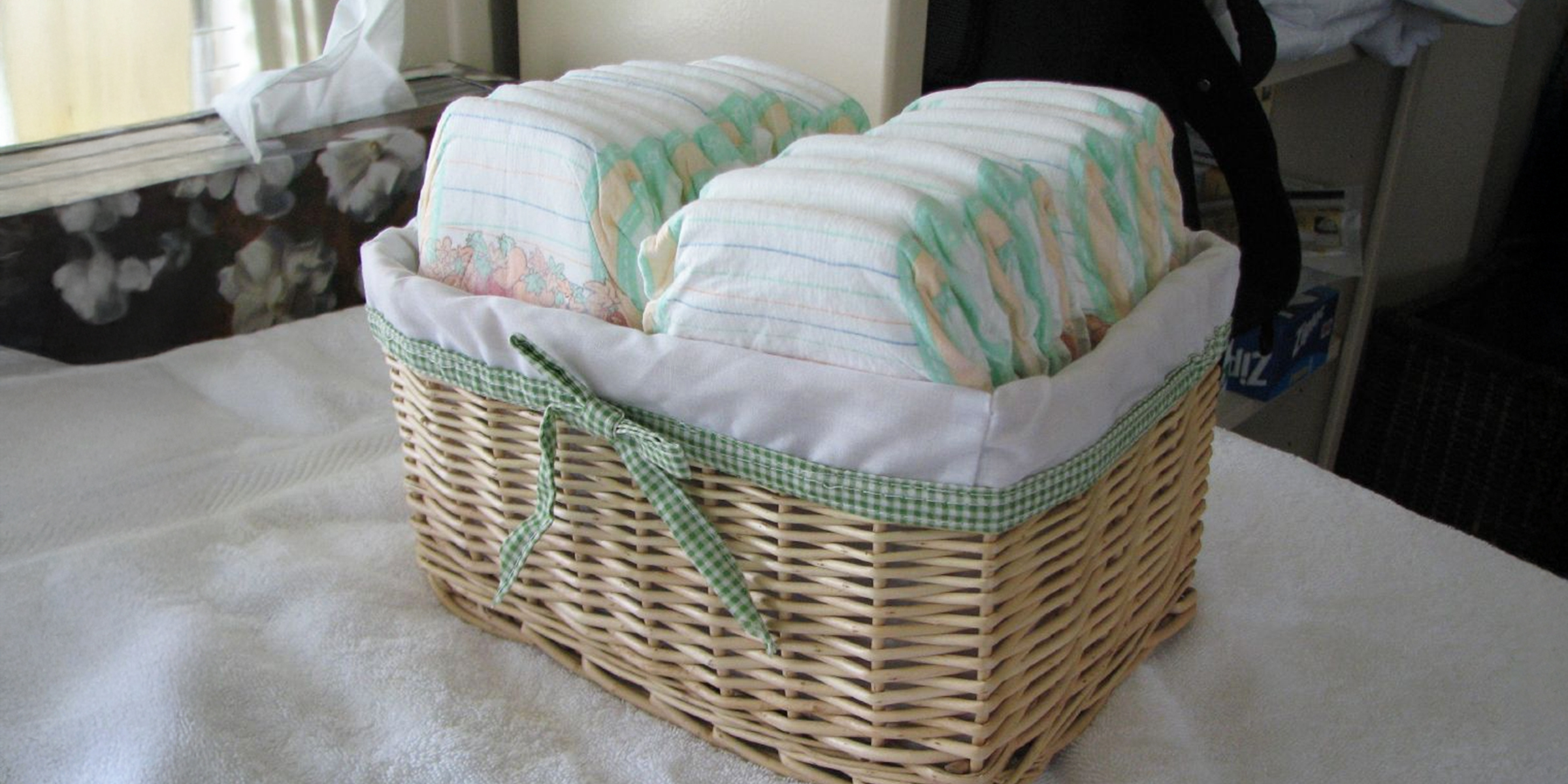 A wicker basket neatly filled with baby diapers | Source: Flickr/IngaMun/CC BY 2.0