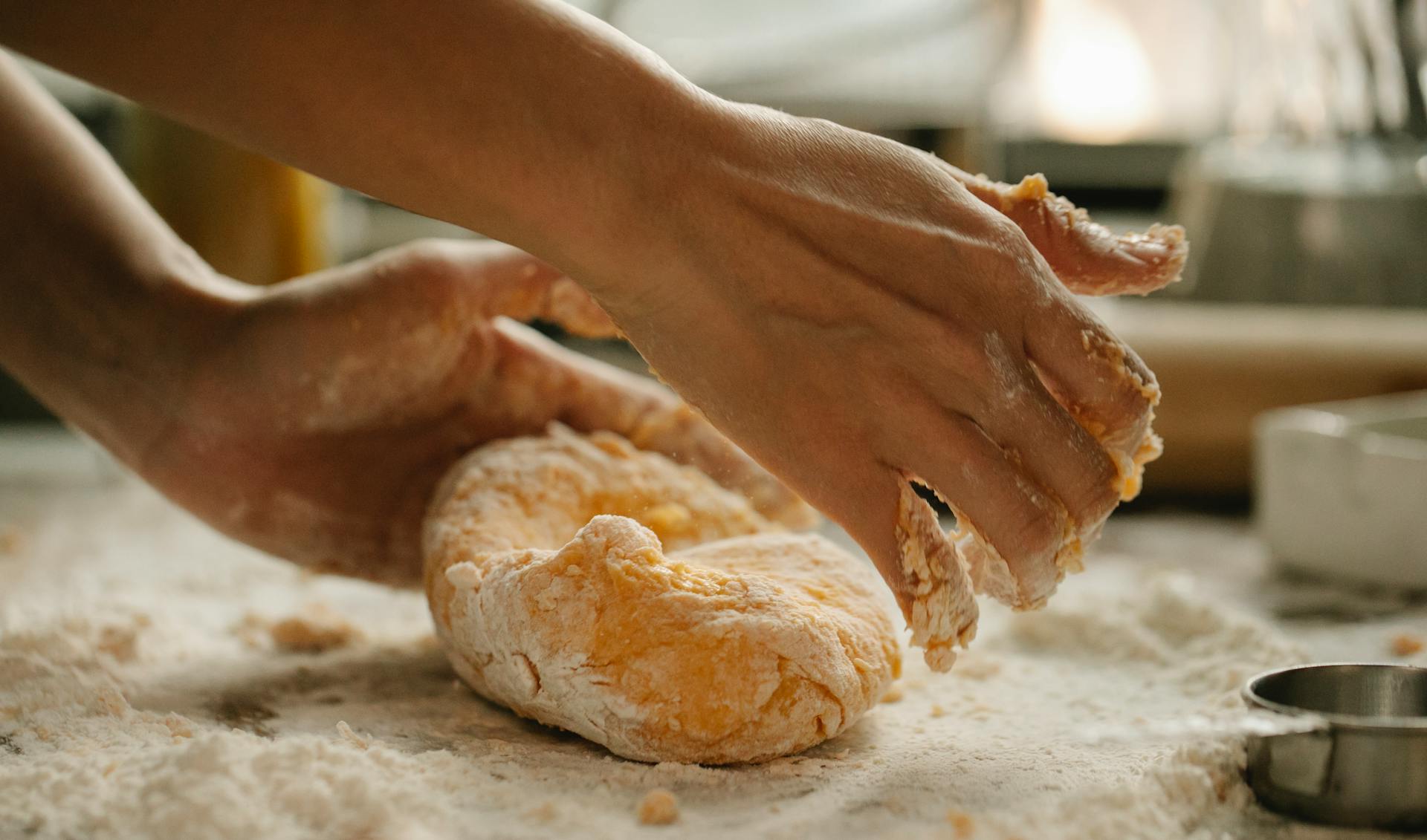 A person kneading dough | Source: Pexels