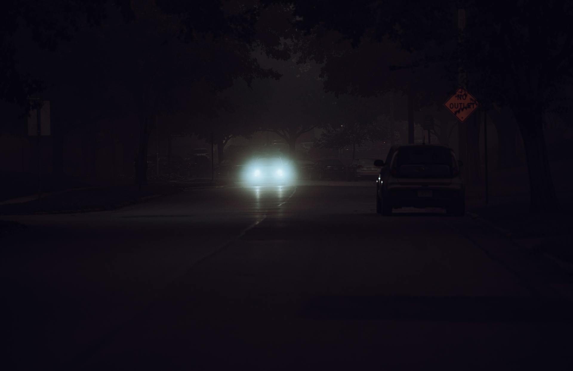 View of headlights of a car approaching in the distance | Source: Pexels