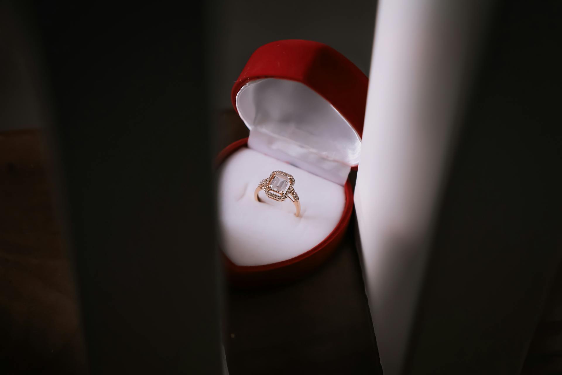A diamond ring in a heart-shaped case | Source: Pexels