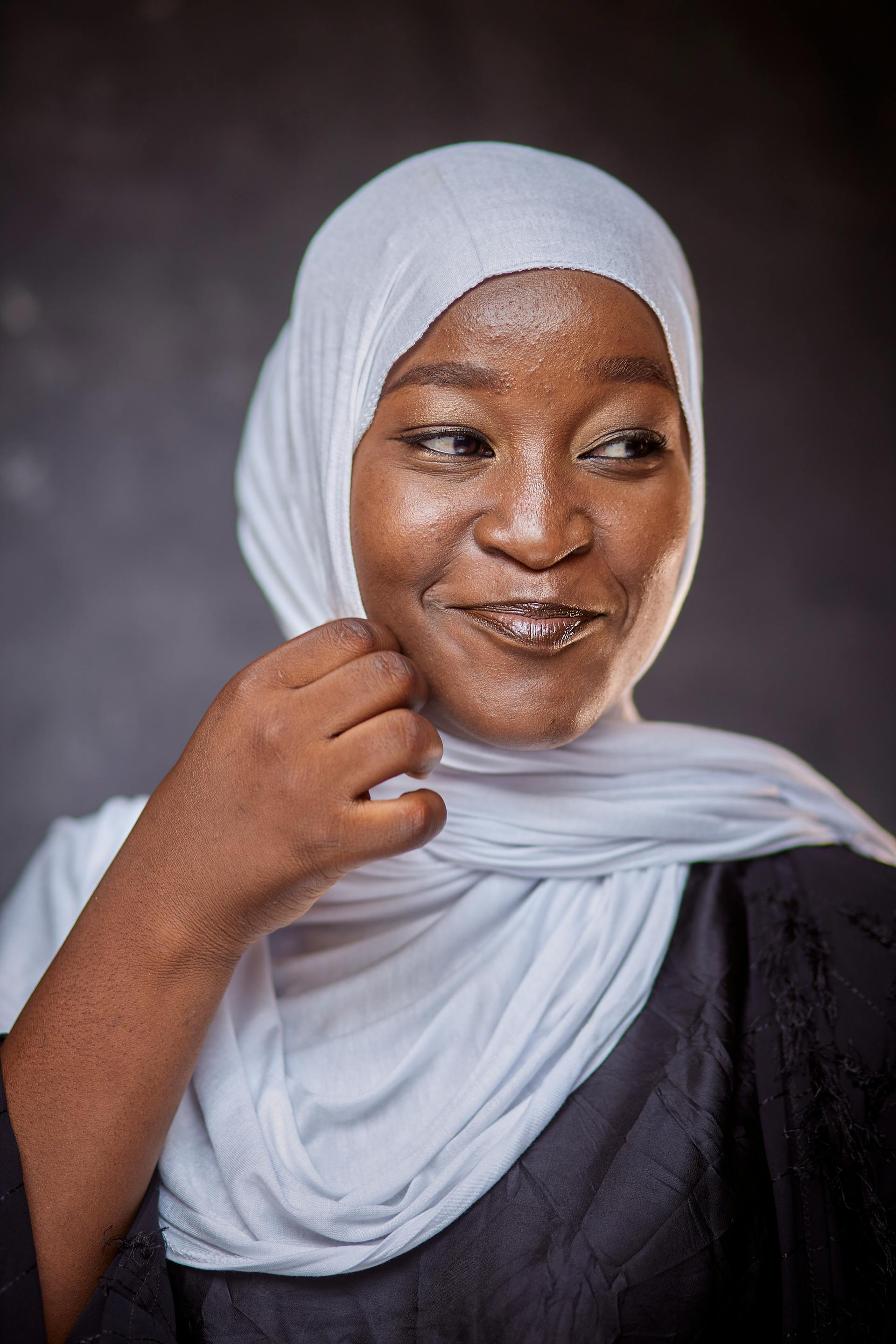 A woman smiling at someone | Source: Pexels