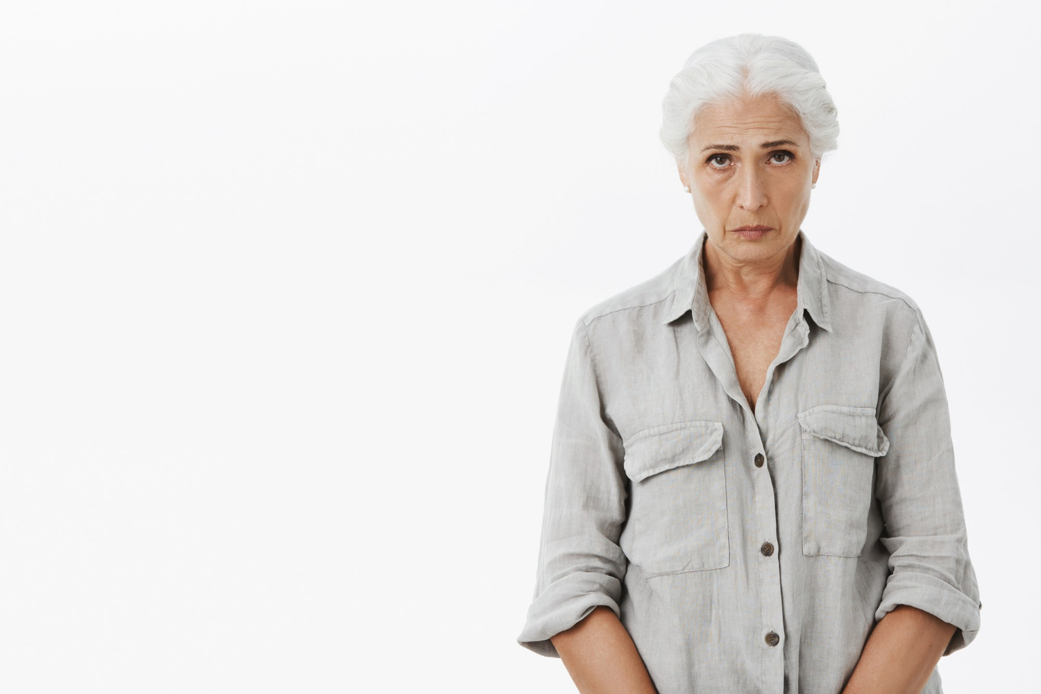A sad senior woman | Source: Freepik