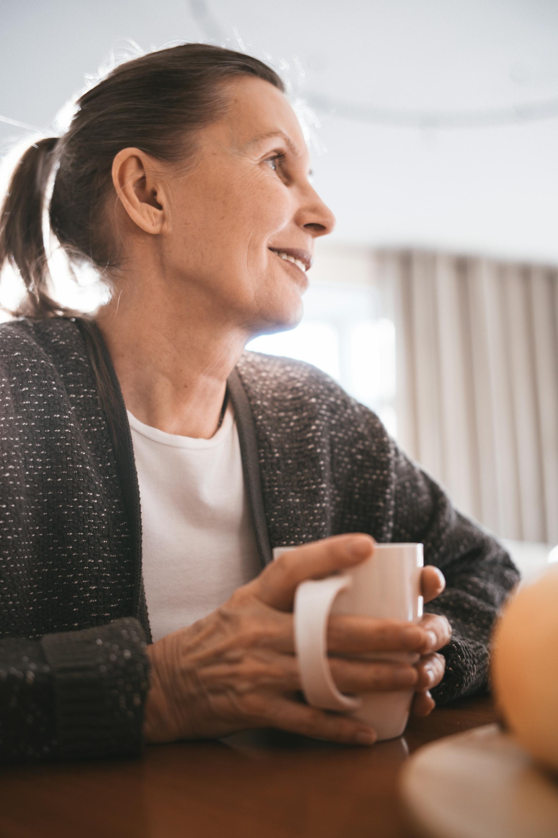 A senior woman holding a mug | Source: Pexels