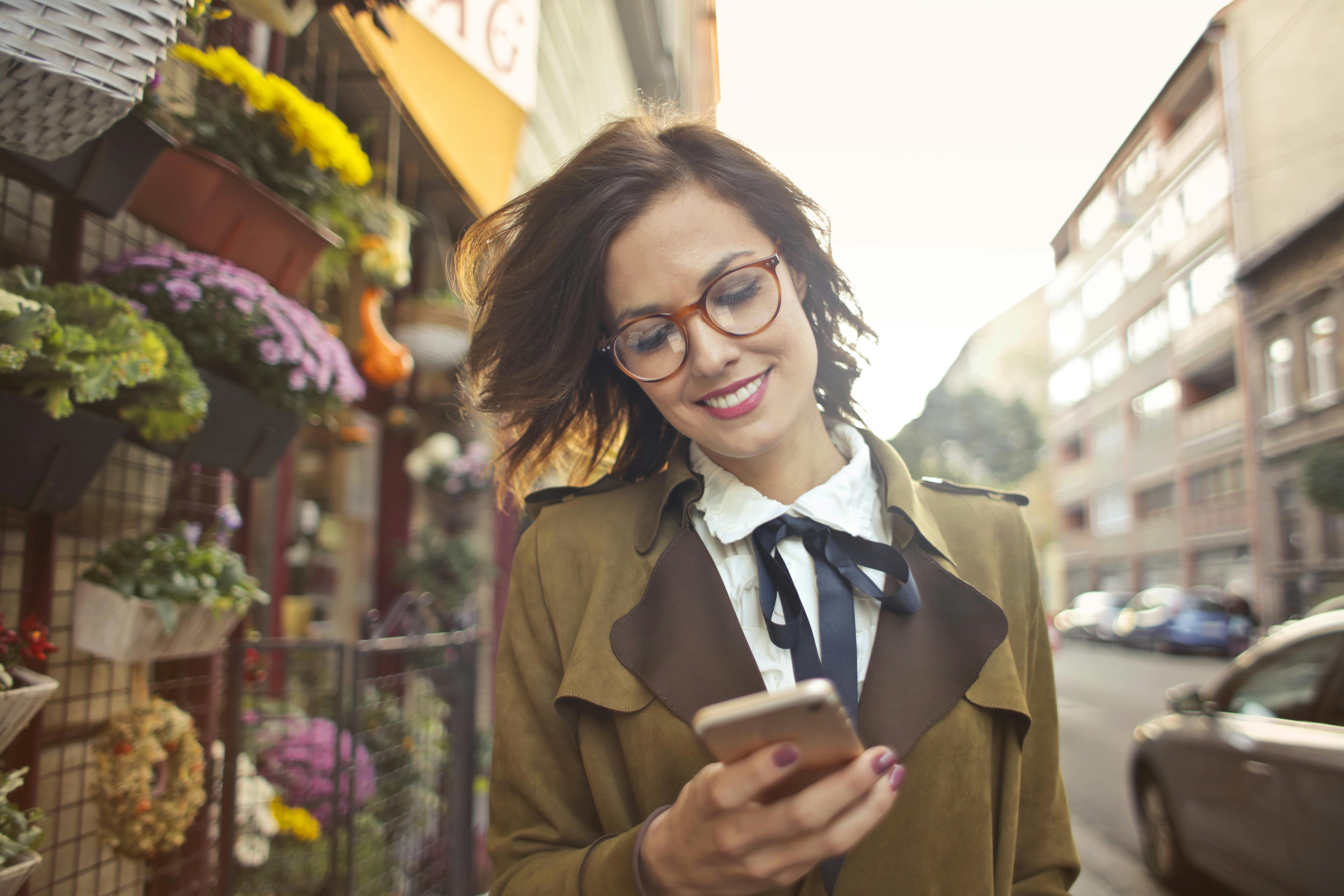 A woman using a smartphone | Source: Pexels