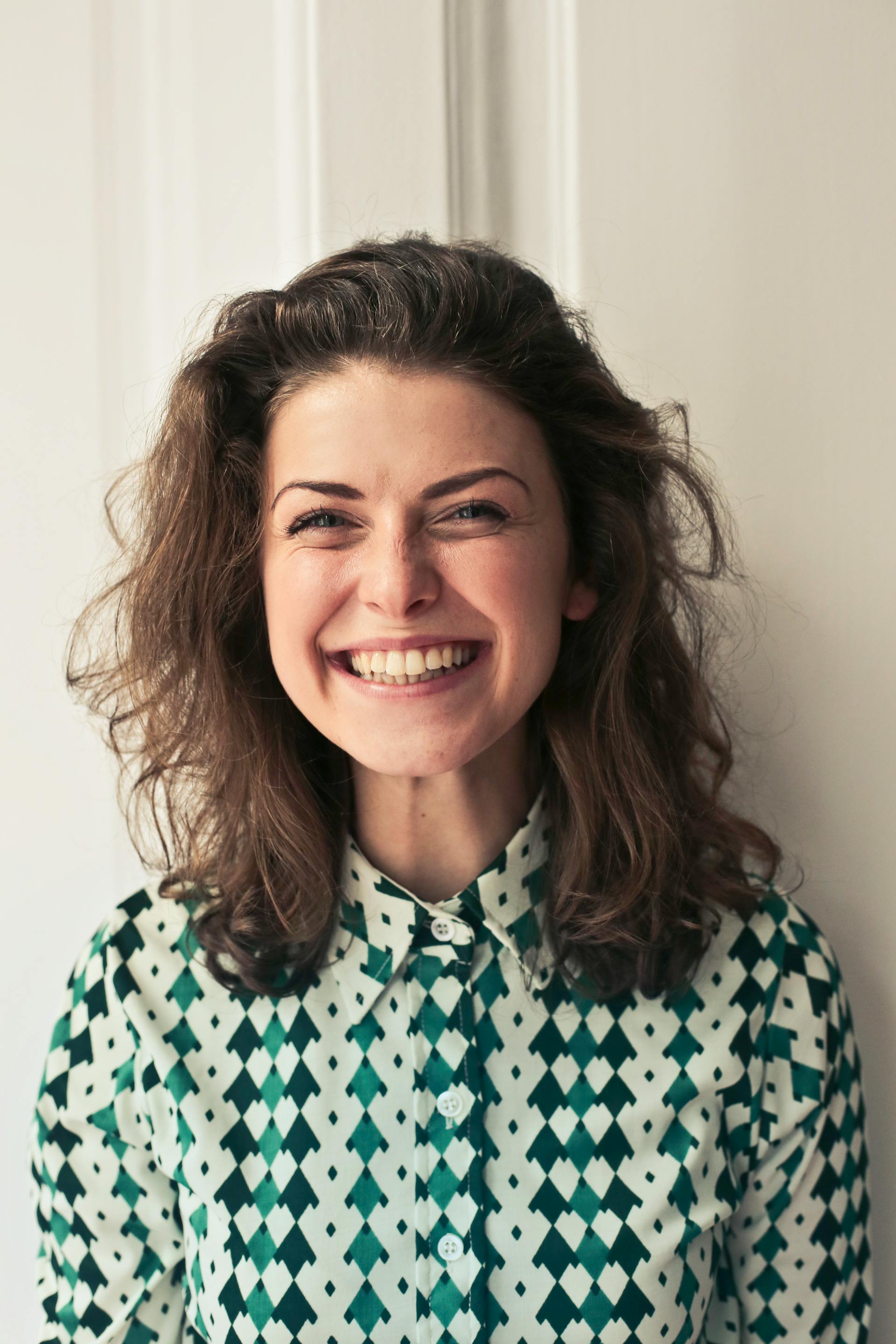 A woman smiling at someone | Source: Pexels