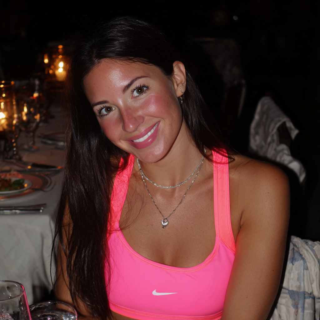 A smiling woman sitting at a table | Source: Midjourney