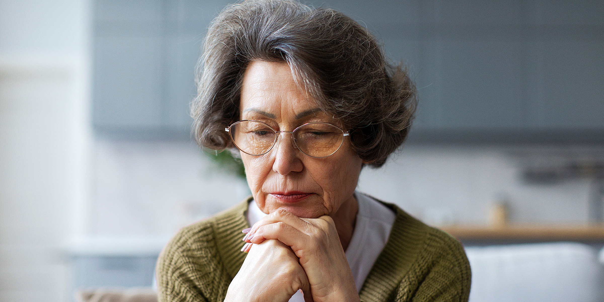 A sad elderly woman | Source: Shutterstock