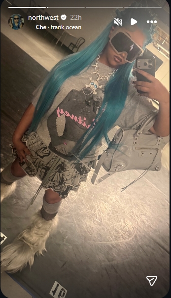 North West posed in another mirror selfie while highlighting her all-gray outfit and furry boots. | Source: Instagram/northwest