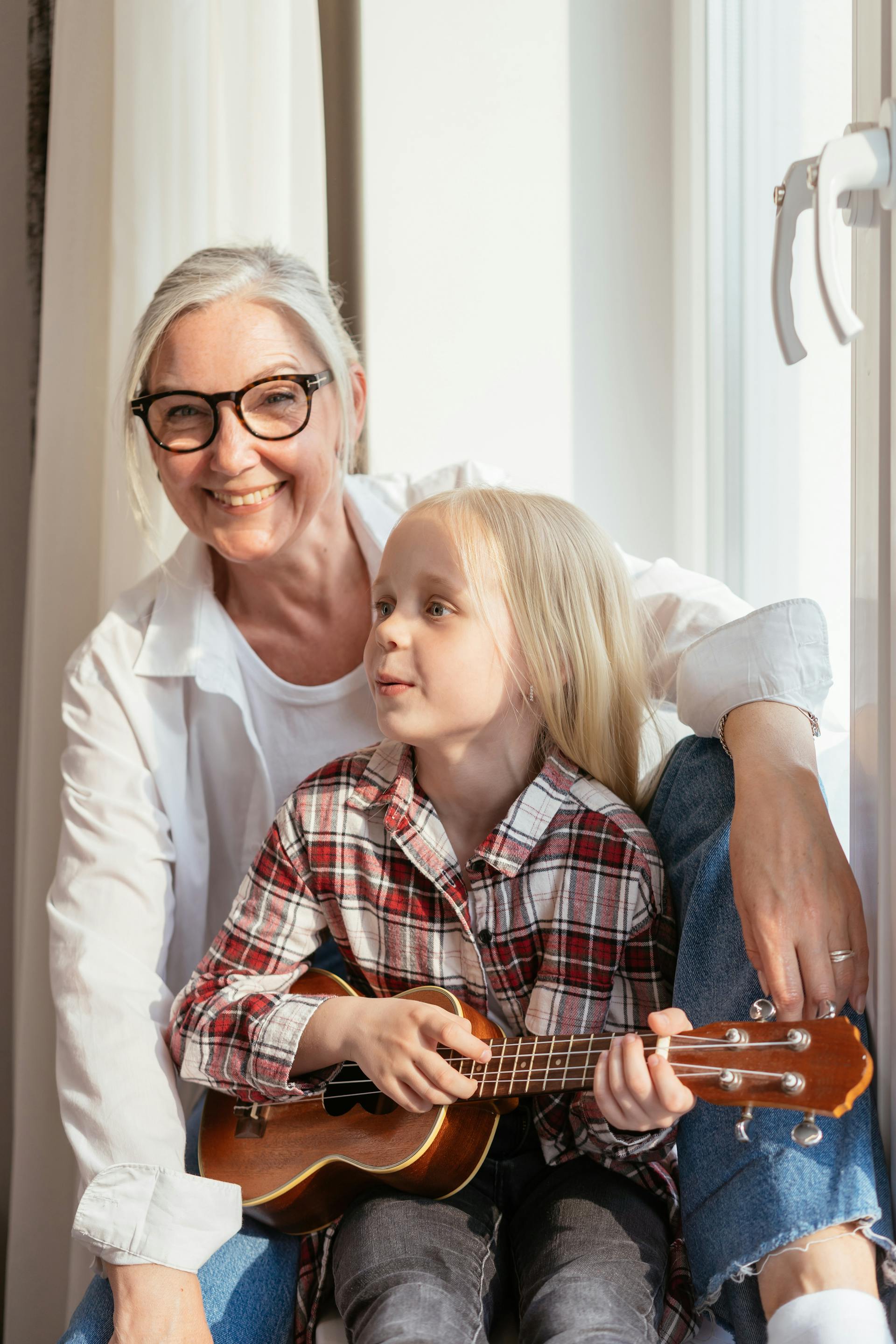 An elderly woman with a child | Source: Unsplash
