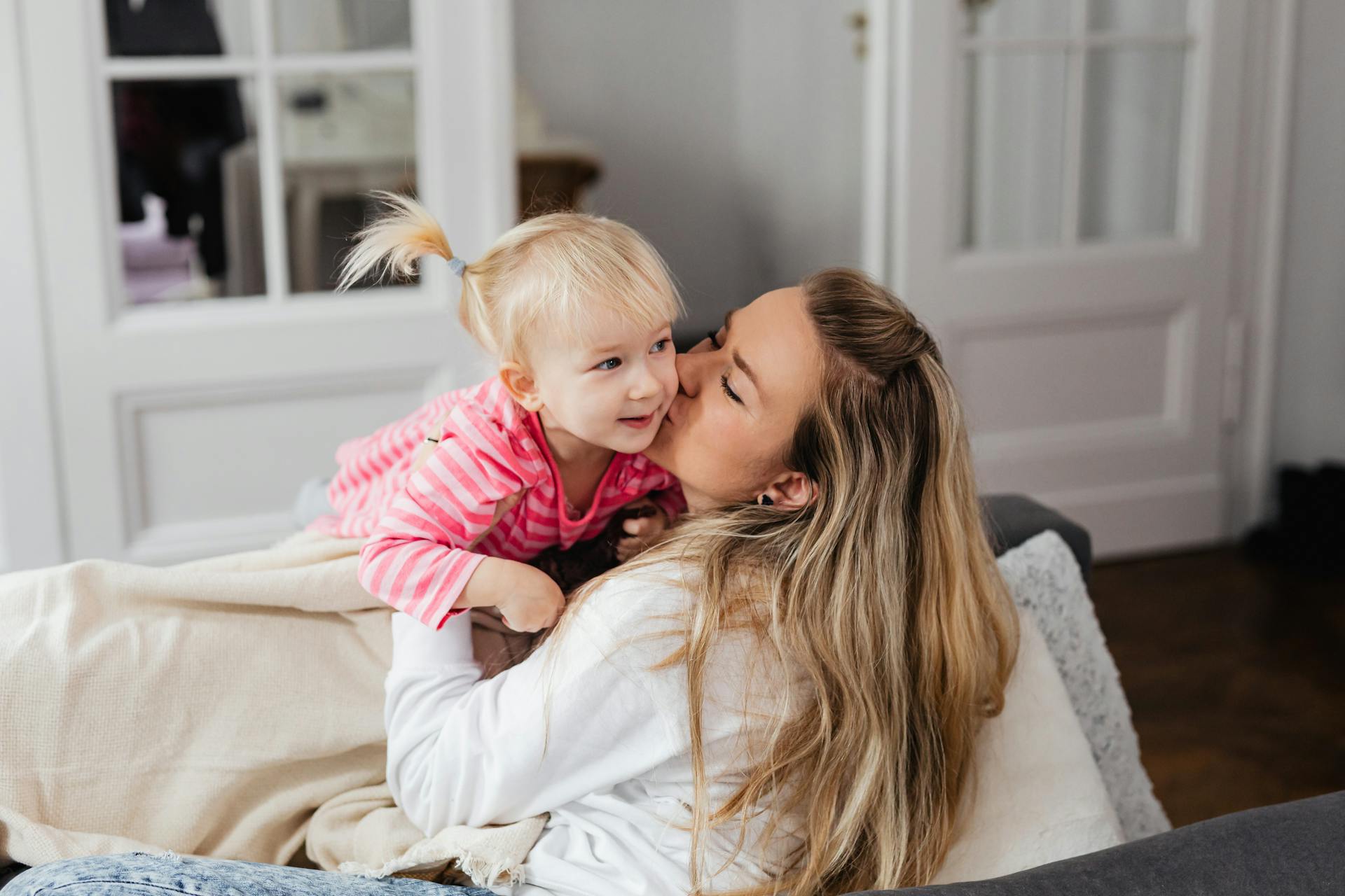 A woman playing with her little daughter | Source: Pexels