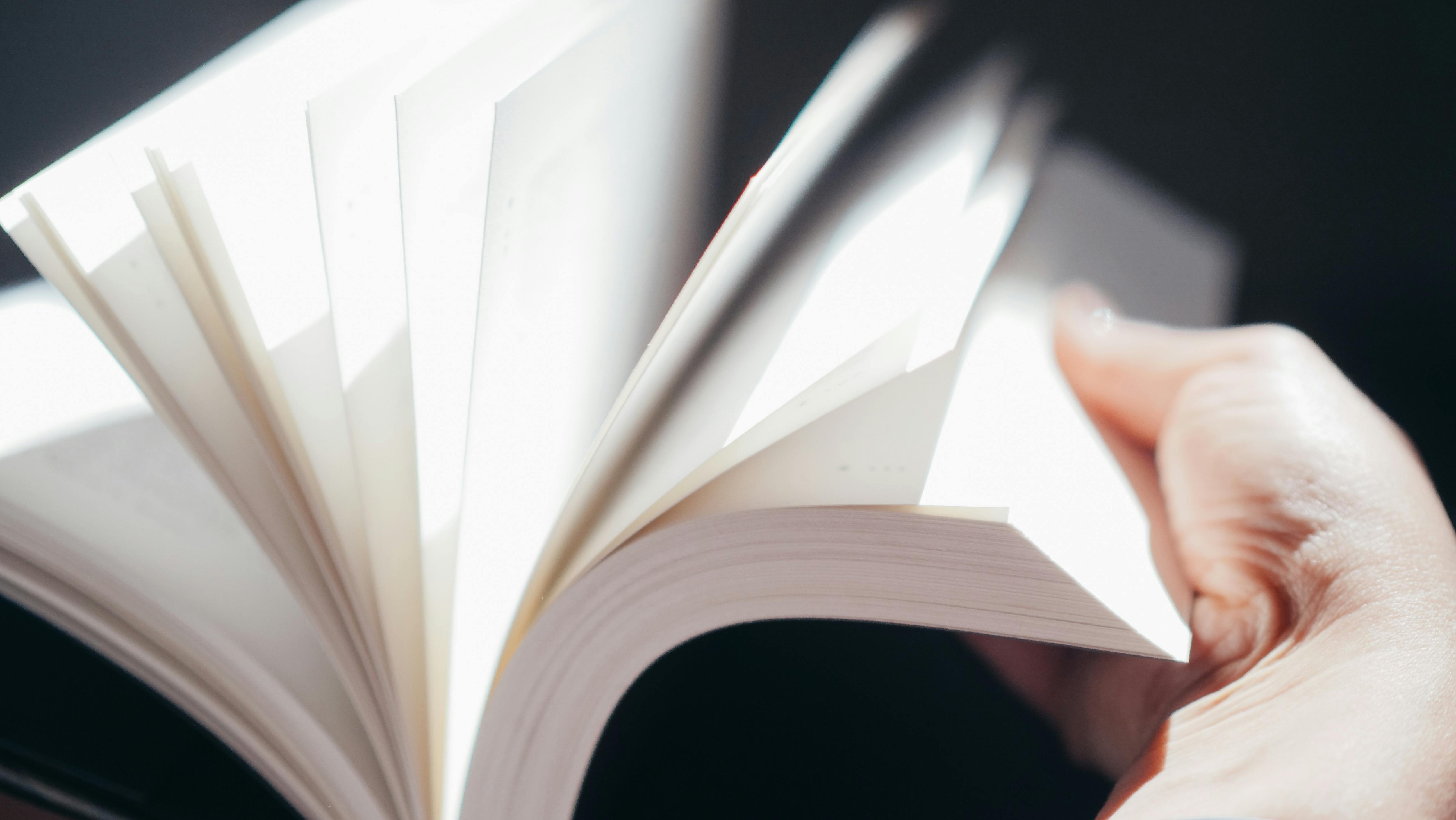A person holding a book | Source: Pexels
