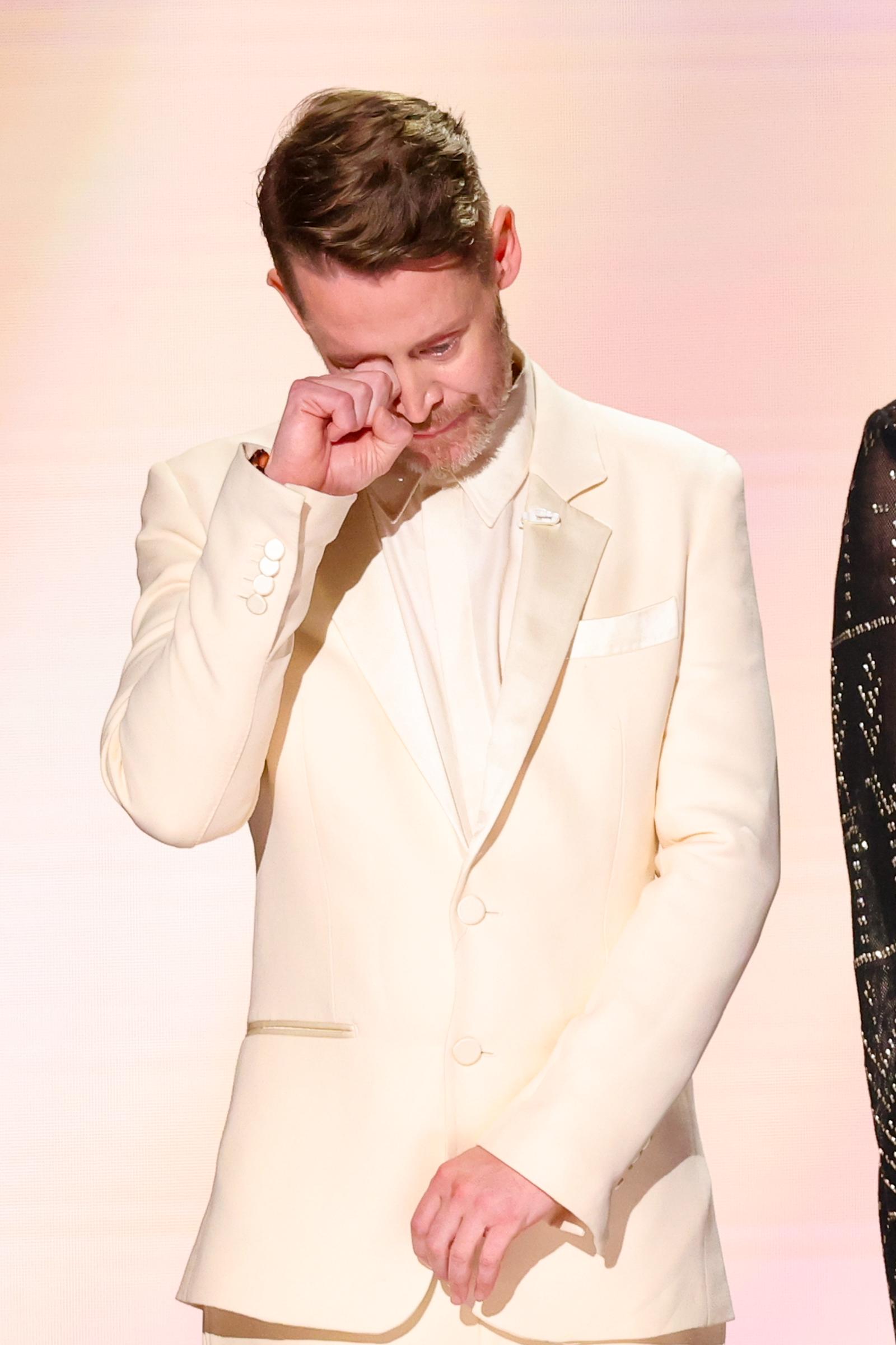 Macaulay Culkin wipes away a tear during an emotional tribute to his former Home Alone co-star Catherine O’Hara at the 78th Primetime Emmy Awards. | Source: Getty Images