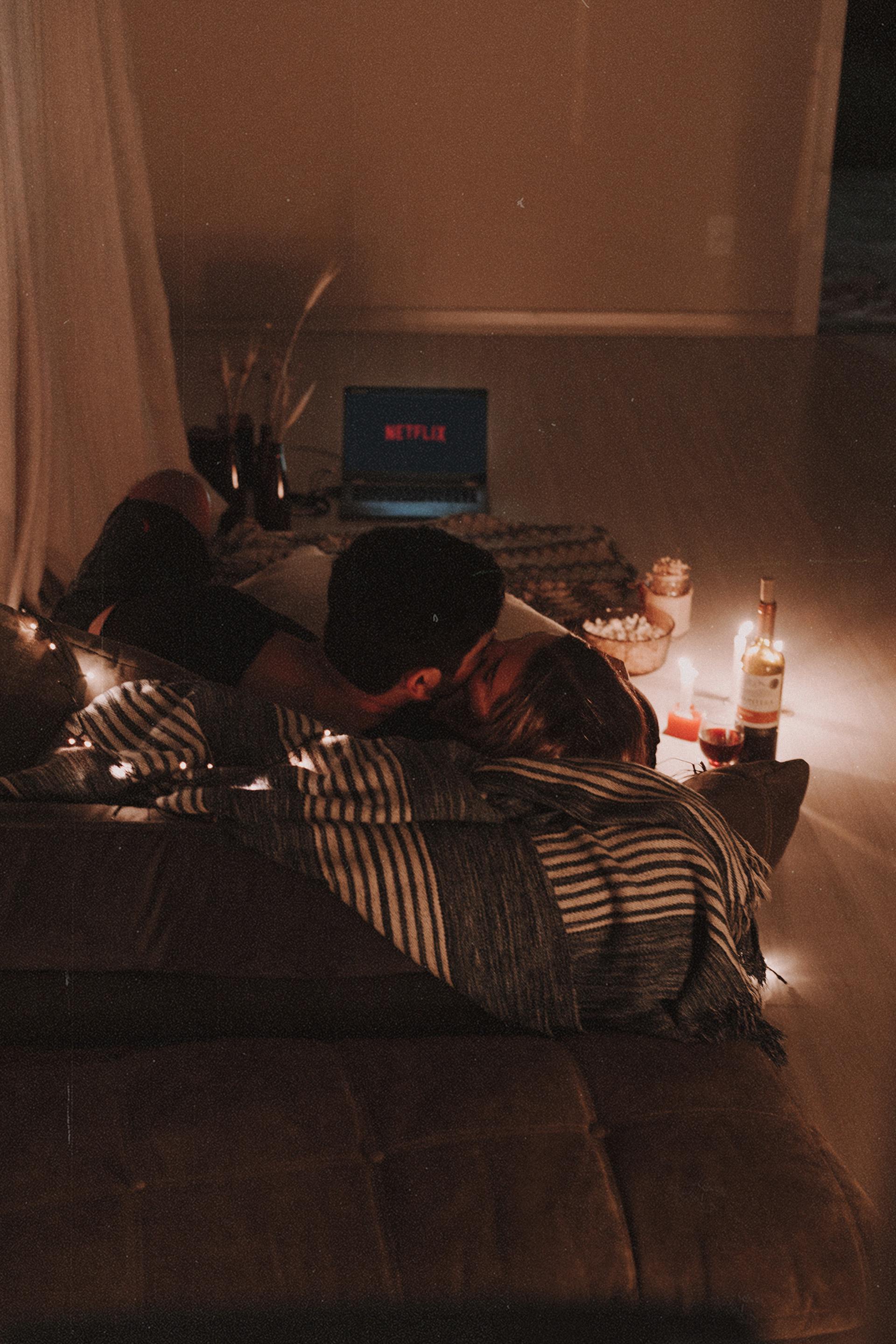A couple cuddling on the couch | Source: Pexels
