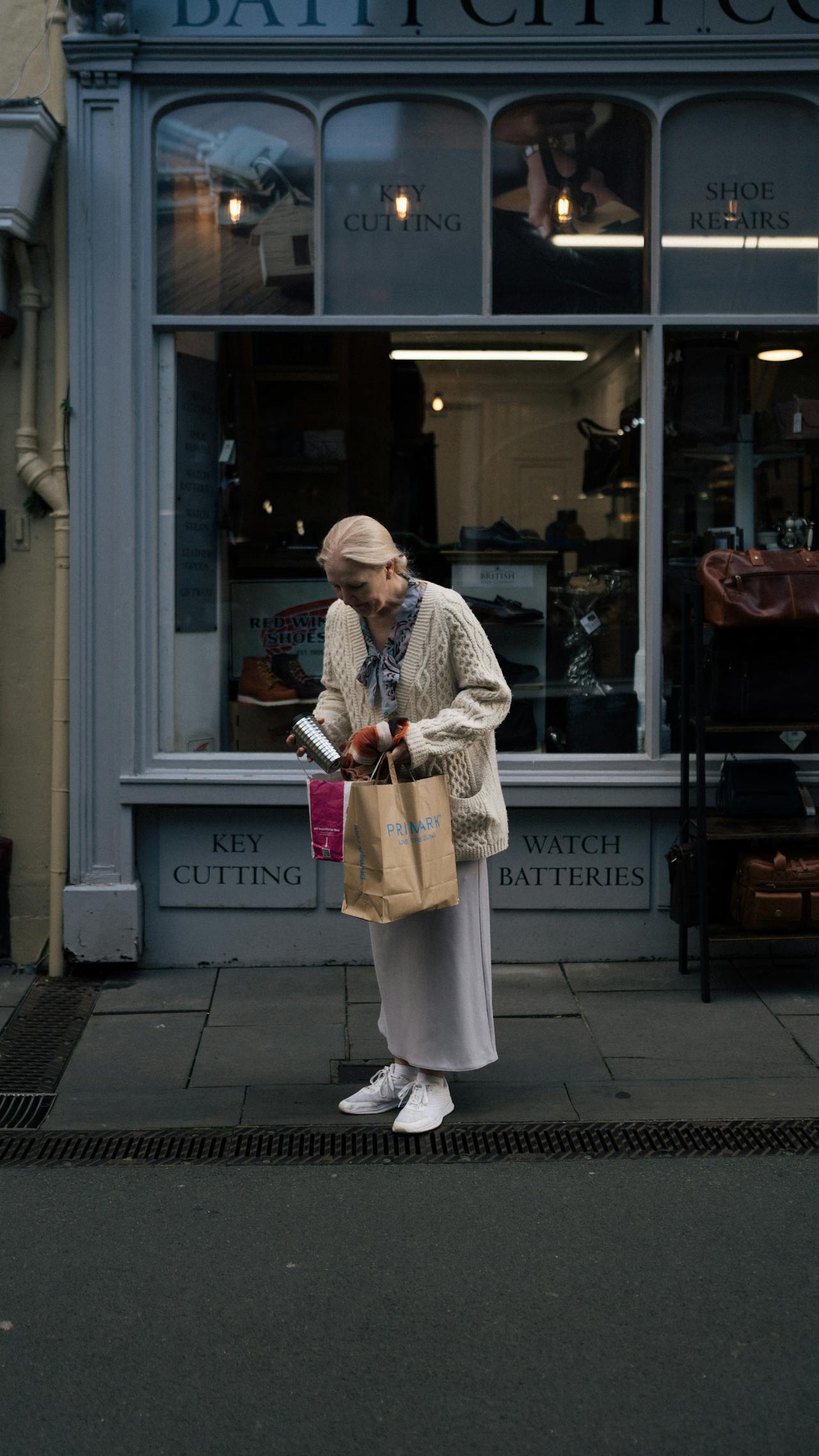An older woman standing outside a store | Source: Pexels