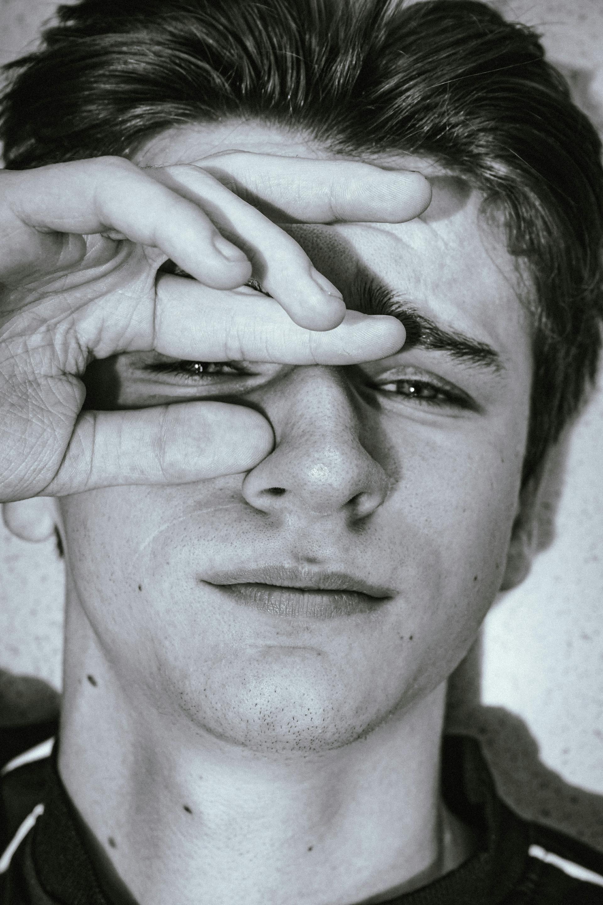 Grayscale portrait of a young man | Source: Pexels