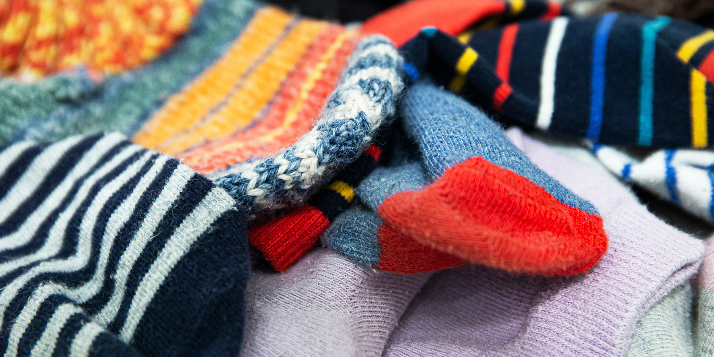 A pile of multicolored socks | Source: Shutterstock