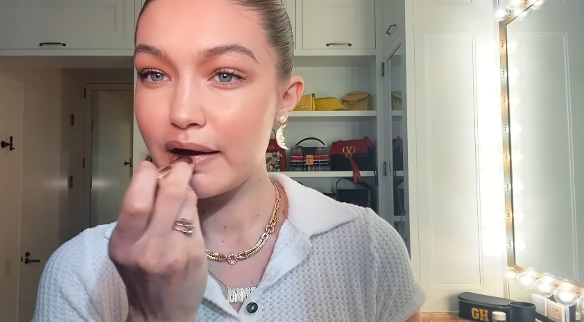 Gigi Hadid doing her makeup routine from a video dated February 4, 2021. | Source: YouTube/Vogue