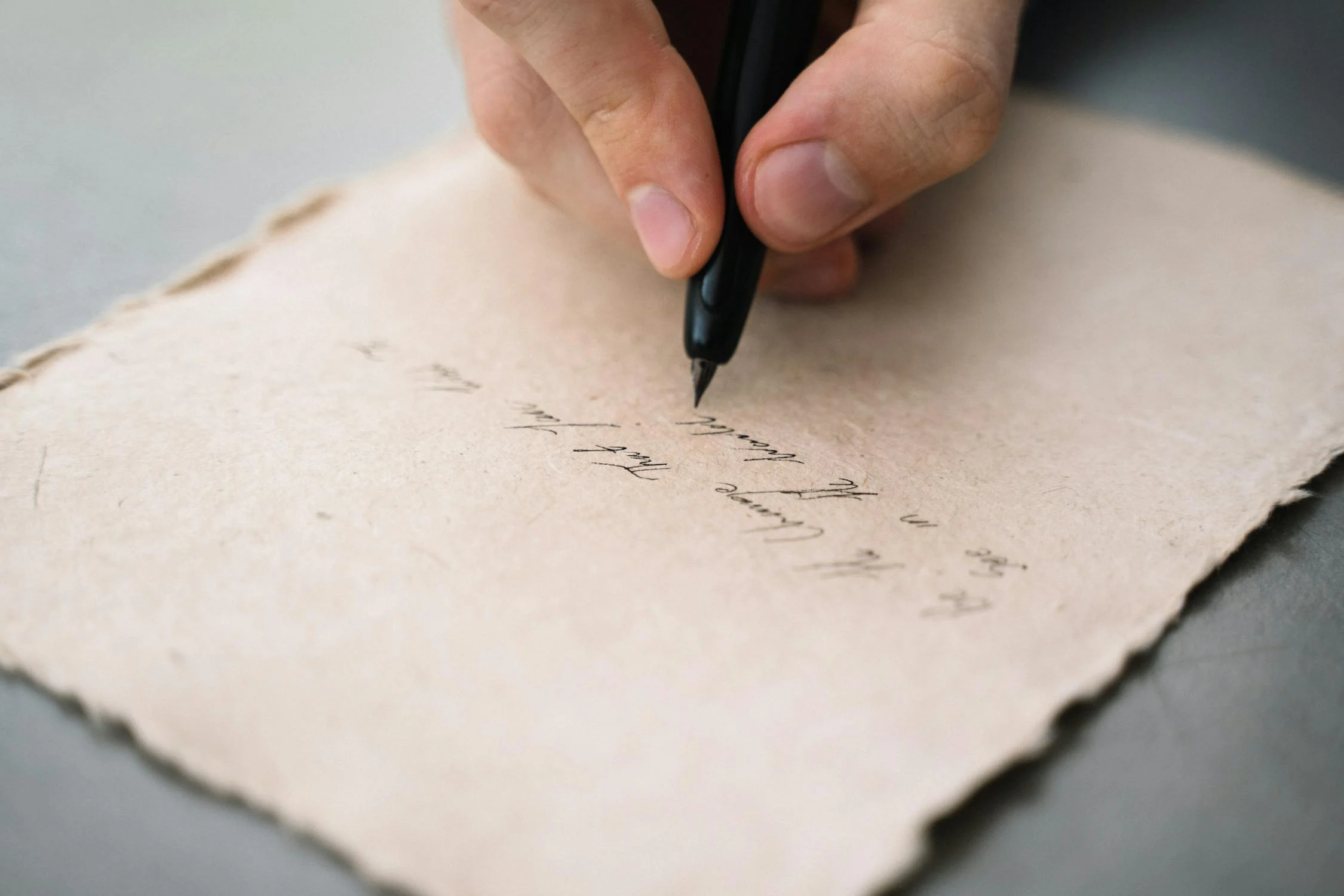 A man writing a letter | Source: Pexels