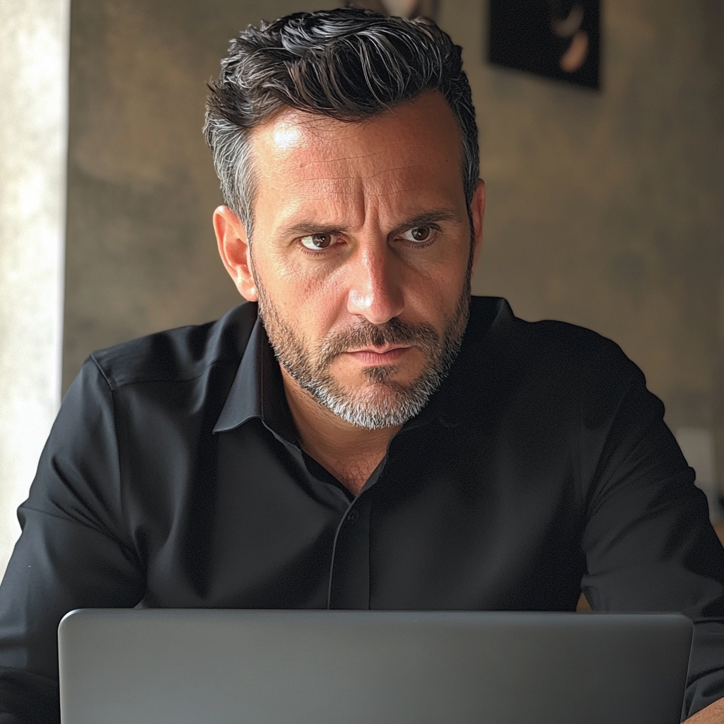 A man sitting at a desk | Source: Midjourney
