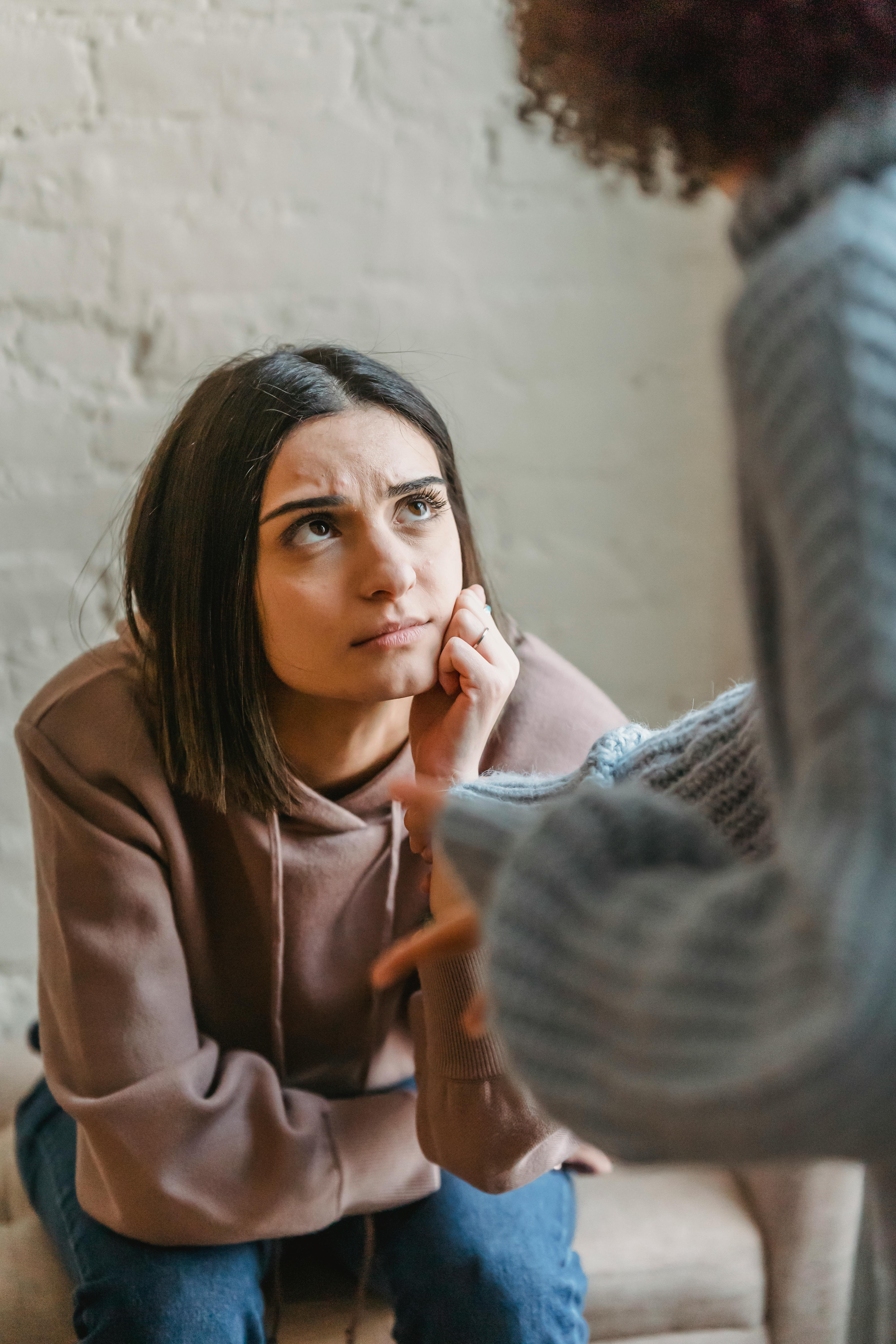 One woman listening to another talk | Source: Pexels